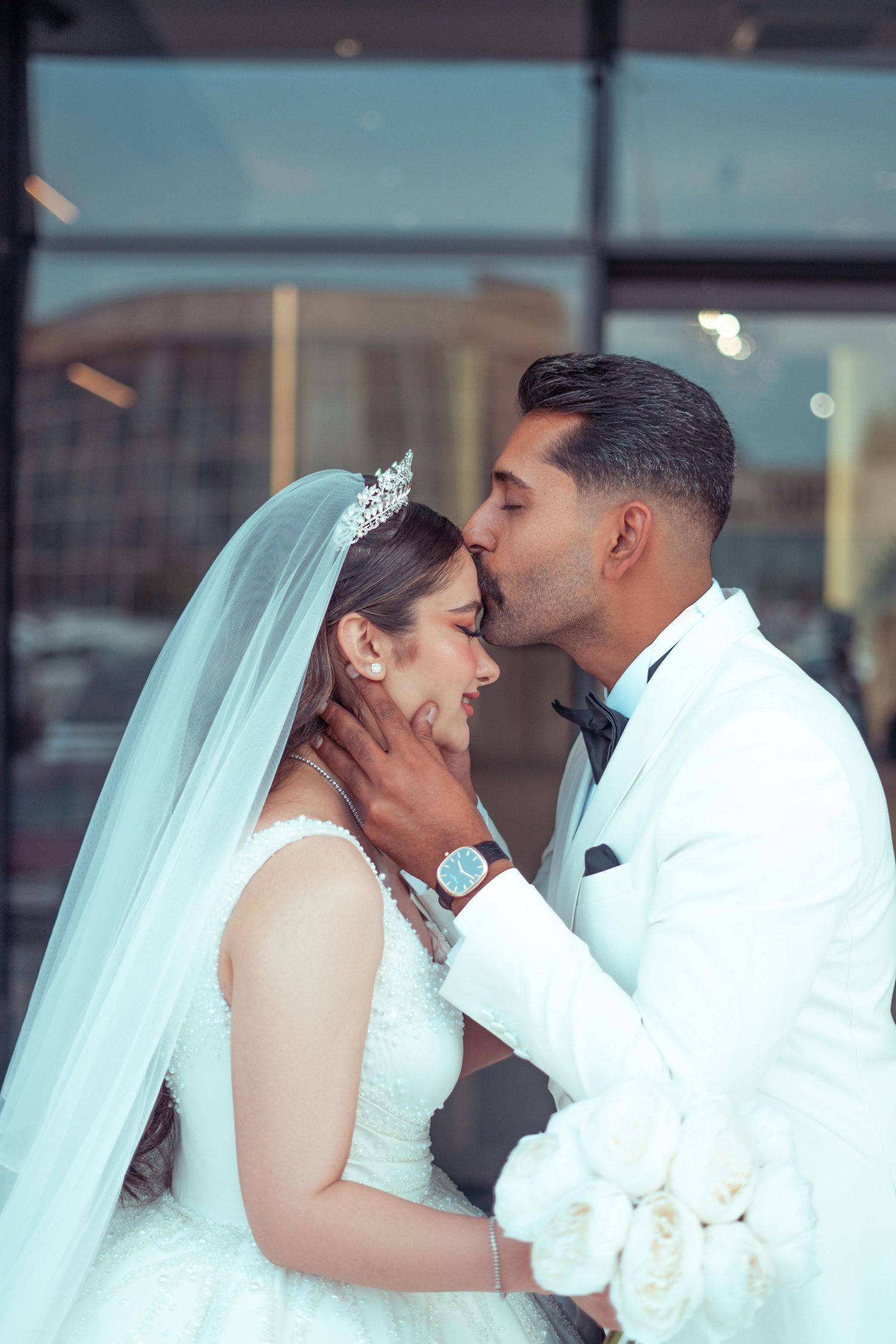 A romantic sequence of wedding photos showing tender moments between newlyweds sharing kisses.  Award Winning Photographer Scottsdale.