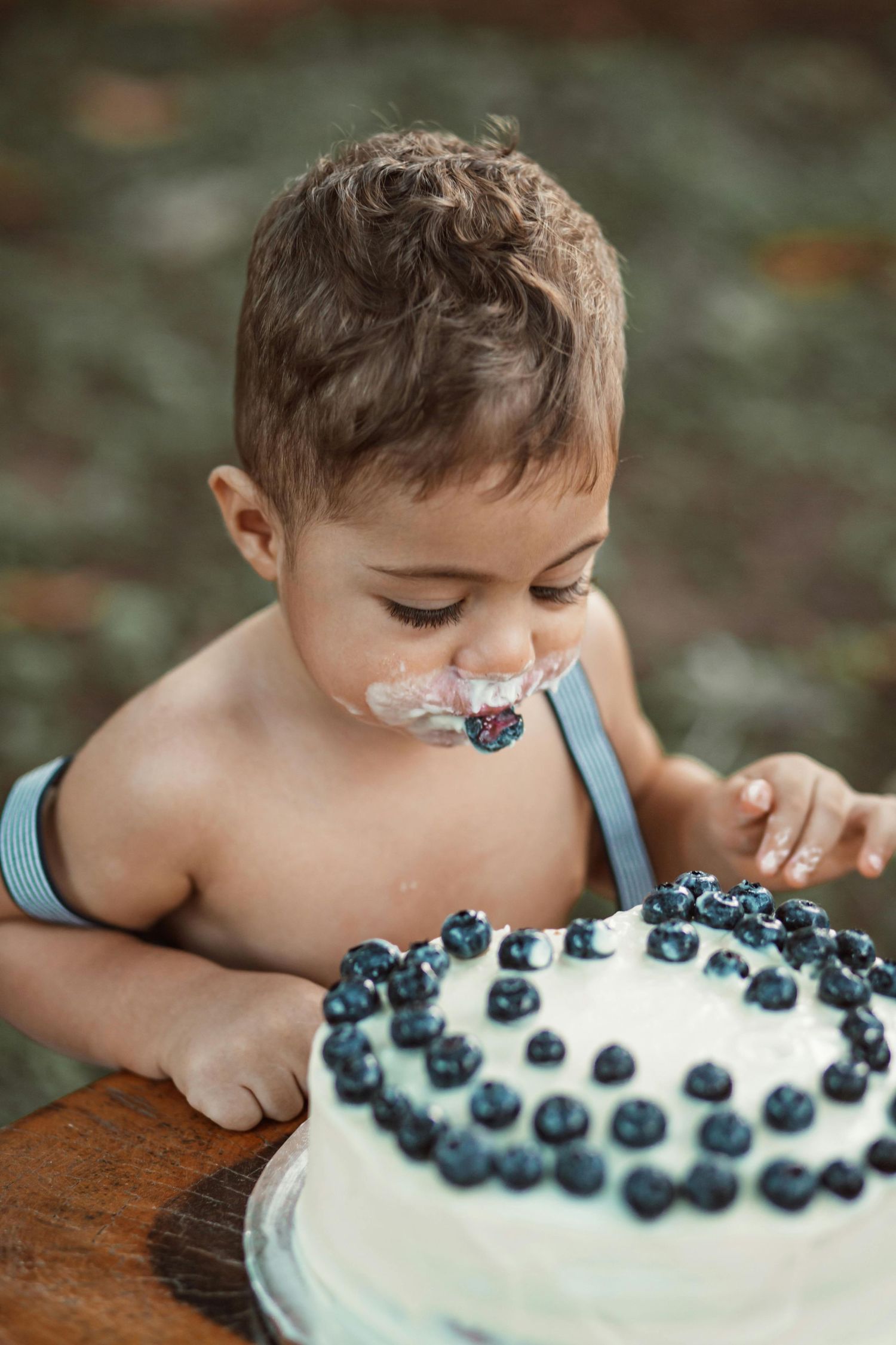 Scottsdale cake smash session, joyful child, playful cake moments, photographed by premier Arizona children photographer.