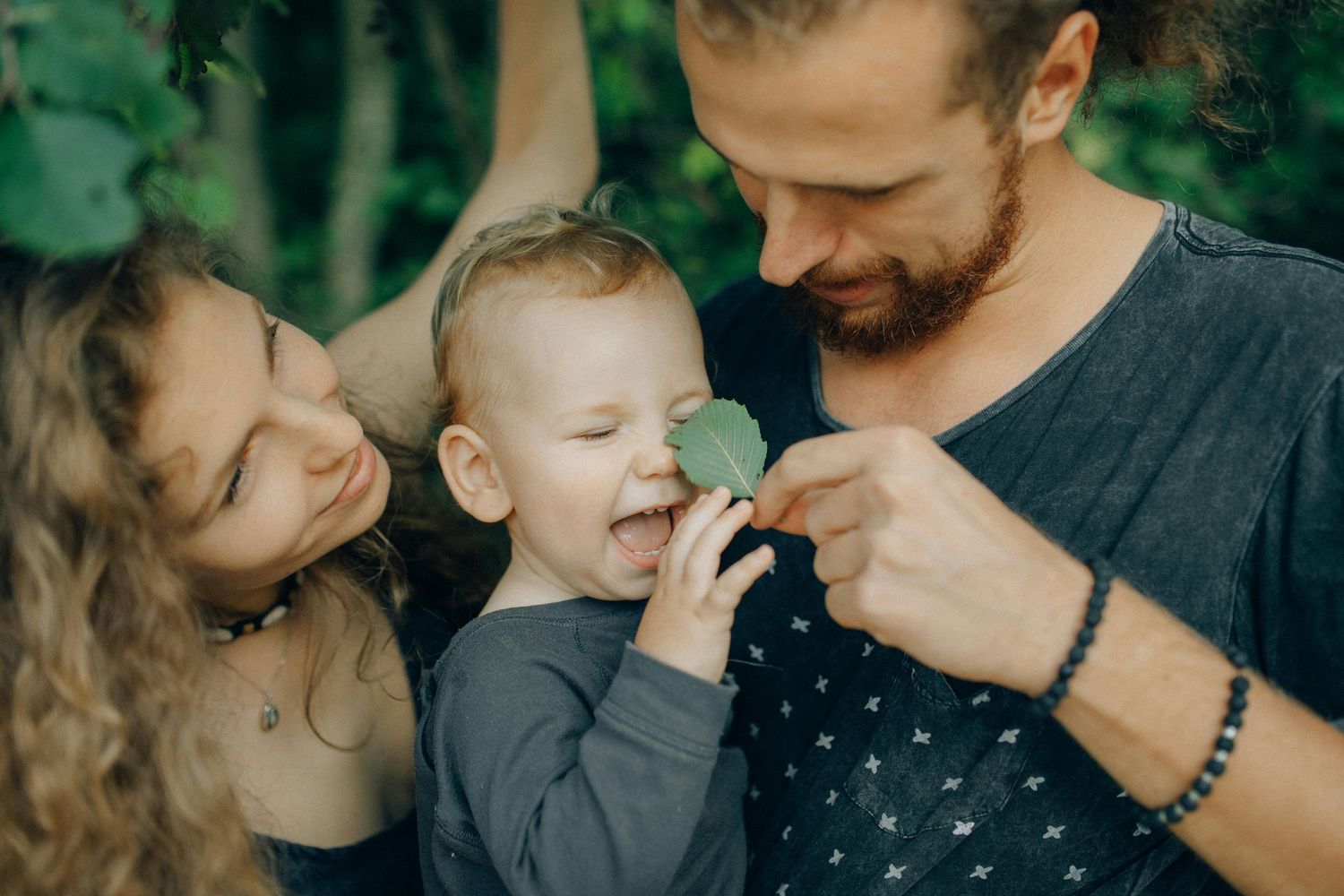 Paradise Valley Arizona Family Photography. A playful family moment shared outdoors with natural greenery in the background.