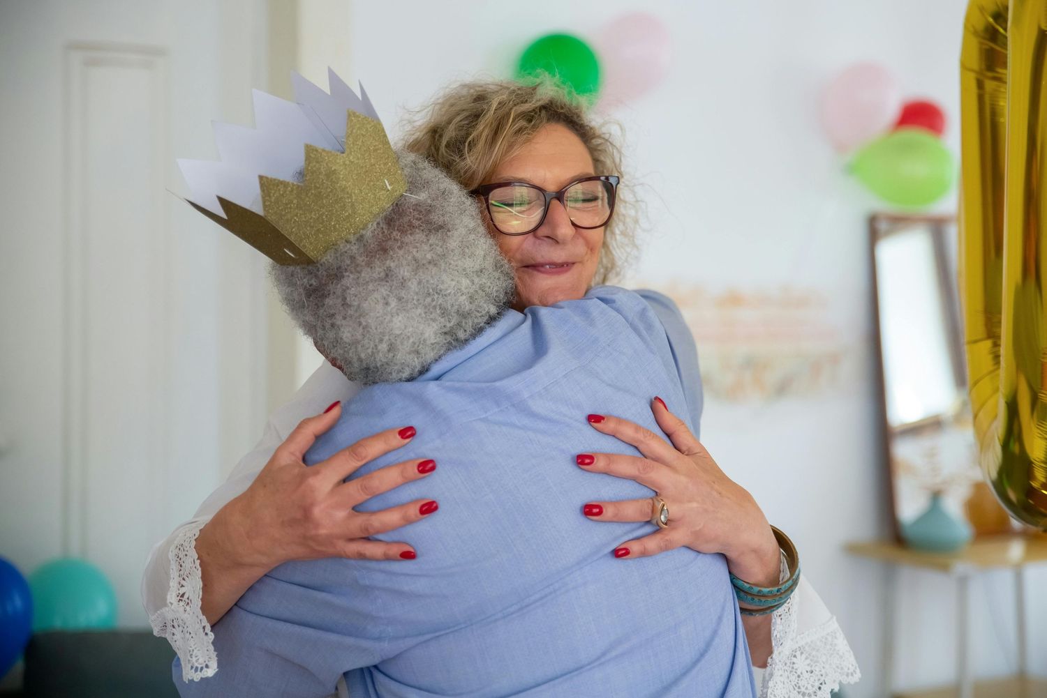 Gilbert Arizona Senior BirthdayHeartfelt hugs and emotional moments captured in a bright indoor setting.