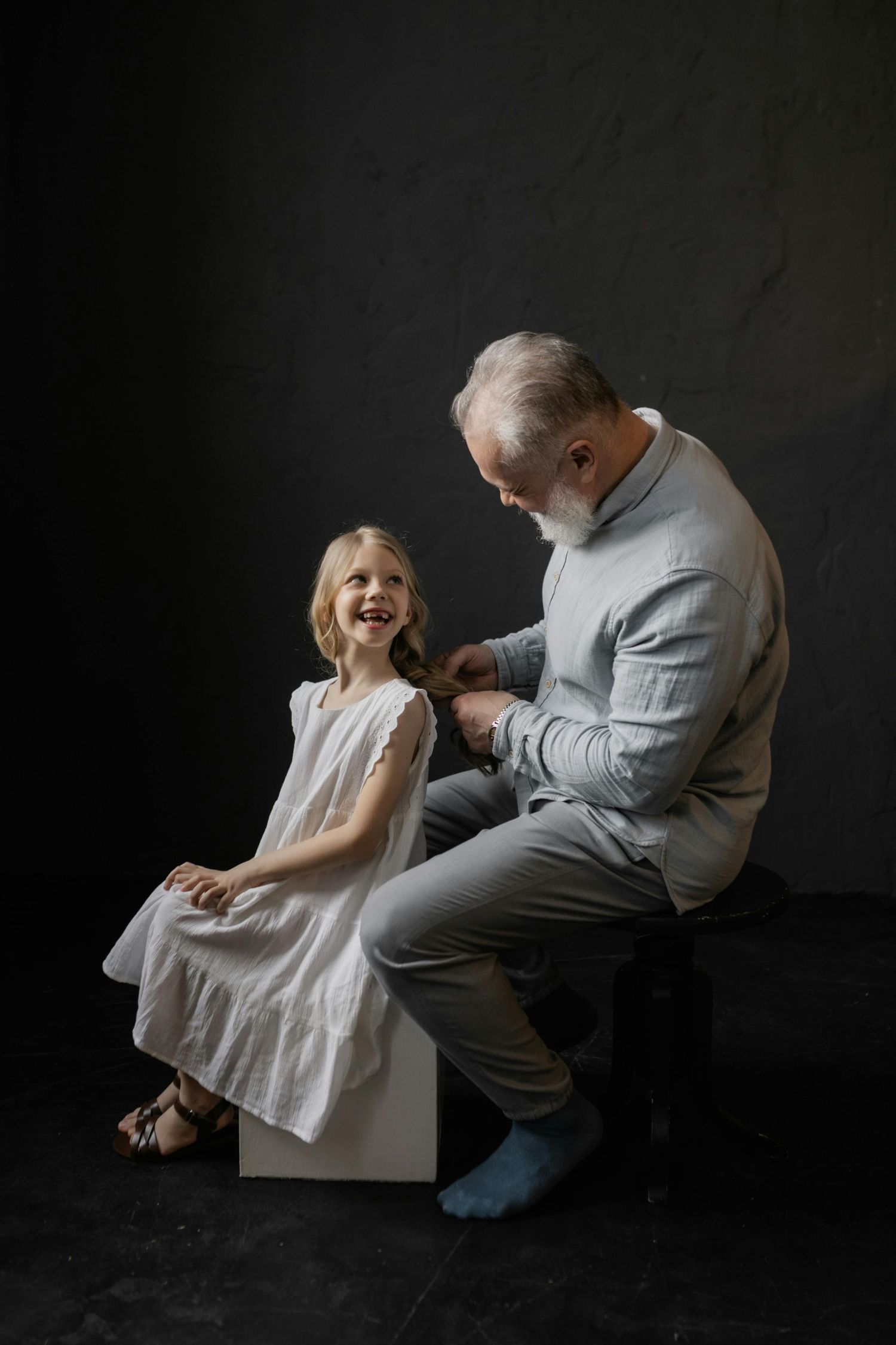 Payson studio family portrait, cheerful smiles, golden light, captured by luxury Arizona family photographer.