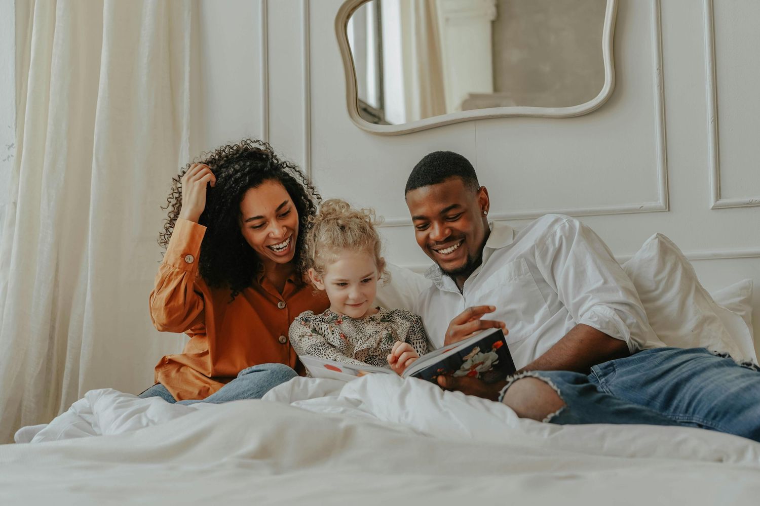 Tempe Arizona Parents reading to kids, golden light filling home, captured as heirloom-quality fine art family portraits.