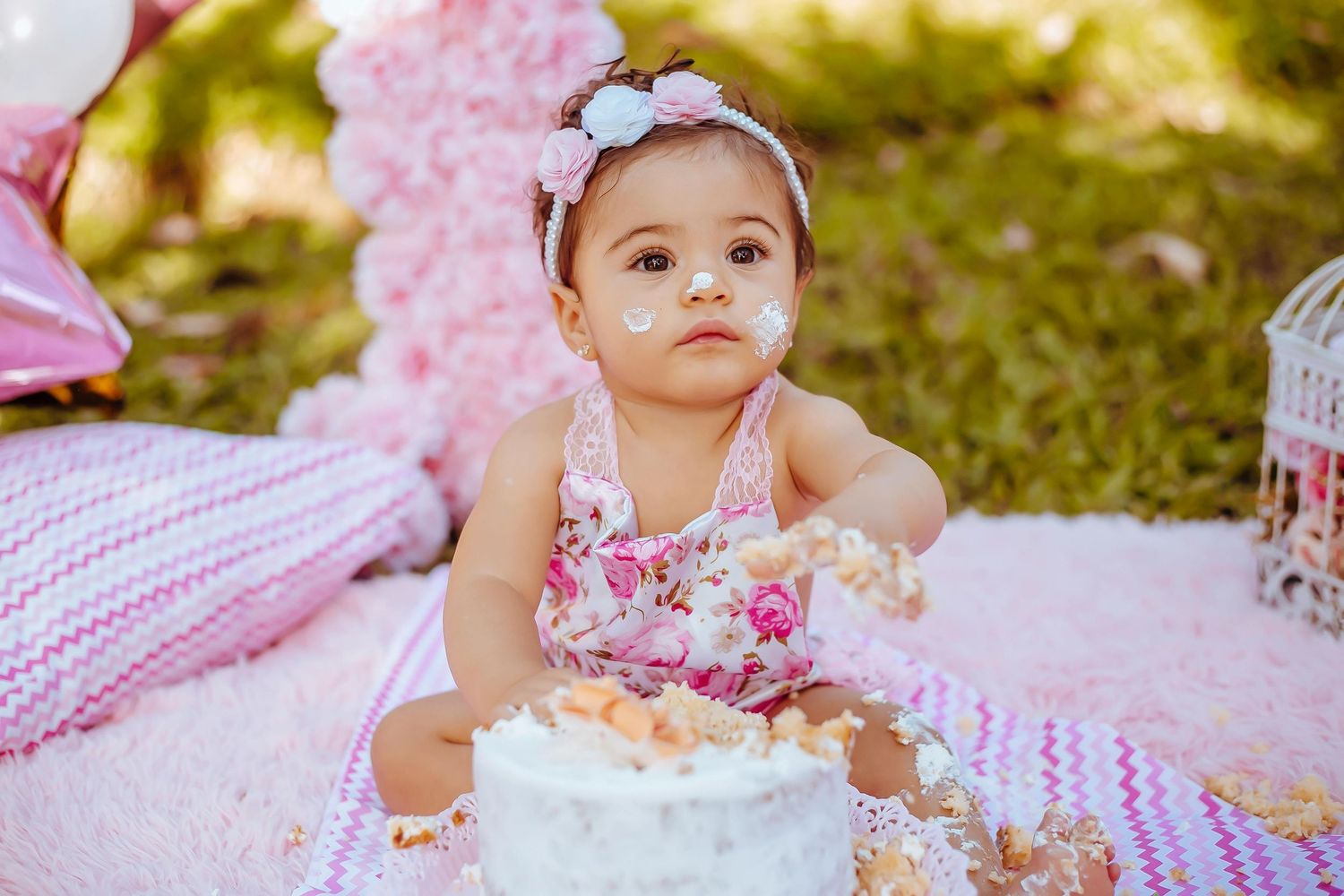 Tucson colorful smash cake portrait, happy toddler, bright decorations, captured by top Arizona luxury photographer.