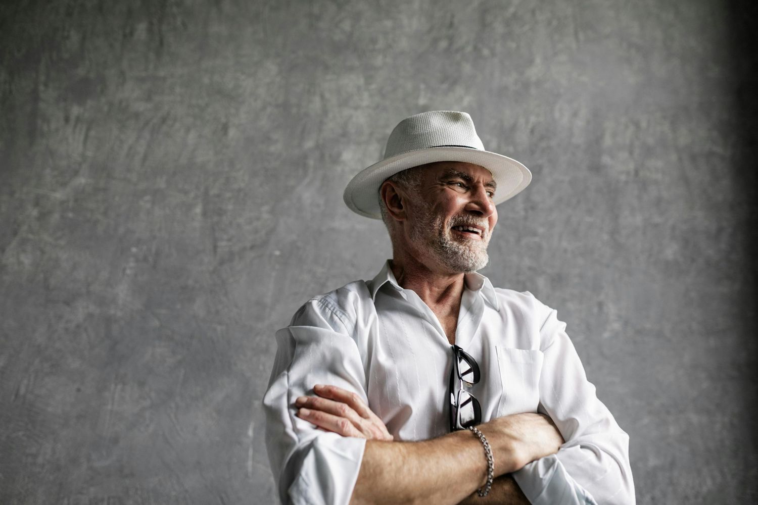 Paradise Valley Arizona Seniors Photography. Person in white outfit and hat strikes dynamic poses in studio setting.