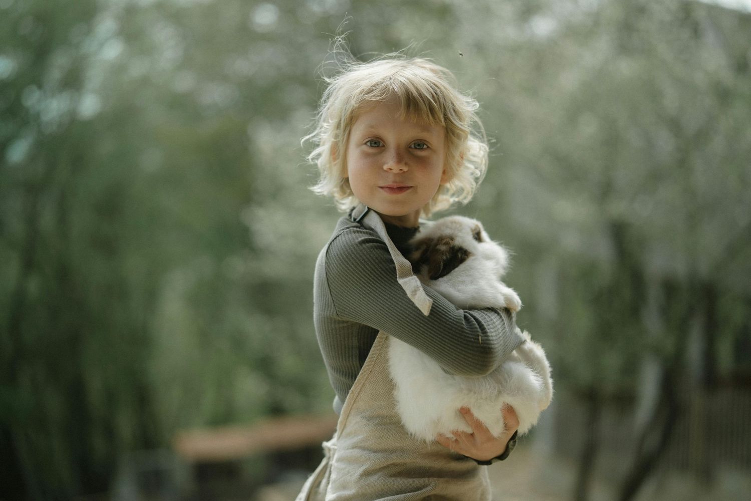 Jerome Arizona Family Photography A small rabbit being held gently against a natural outdoor background.