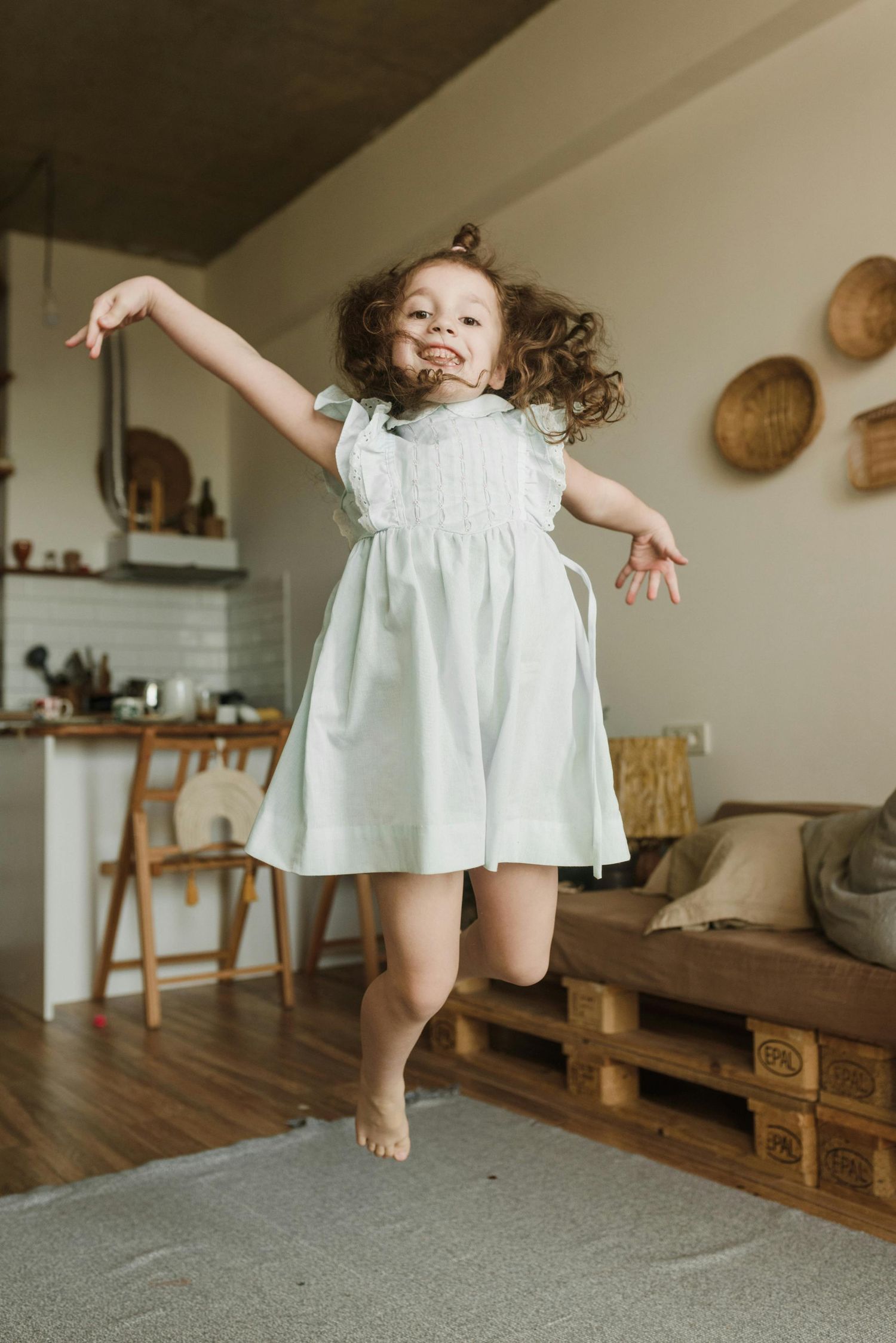 Camp Verde, Arizona parents and kids dancing in their home, joyful energy, captured by an Arizona family photographer.