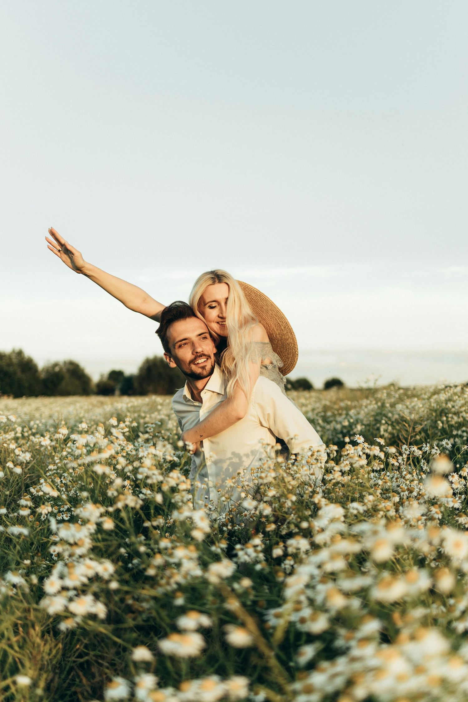 Romantic partners intertwined in meadow, photographed with dreamy, natural, heartfelt Arizona engagement artistry. Fountain Hills.