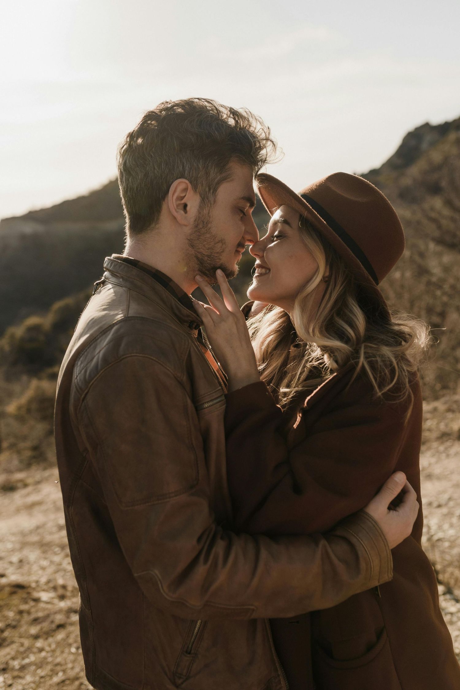 Prescott mountain view, intimate proposal, red-hatted woman, couple celebrating, photographed by premier engagement photographer.