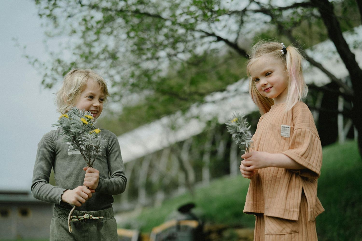 Kingman Arizona Family Photography kids enjoying a spring day under blooming trees.