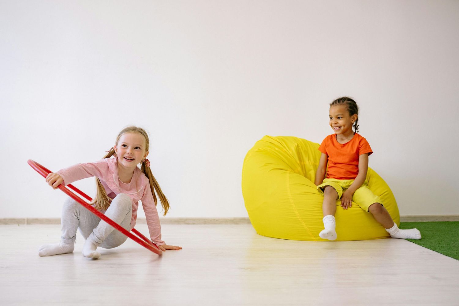 Queen Creek  Arizona Daycare Photography Students playing and learning in a bright indoor educational space with colorful accessories.