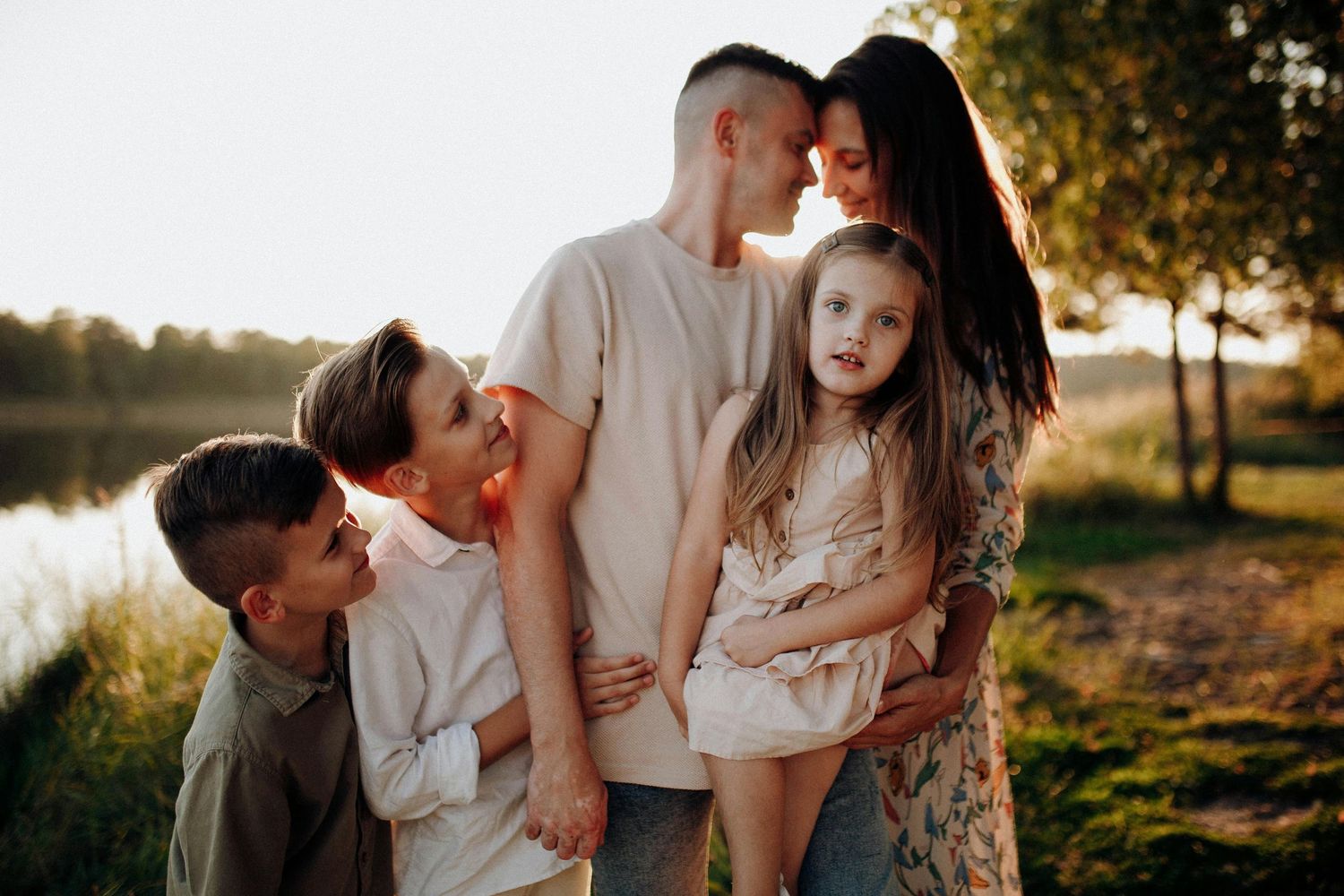 Prescott Arizona, mountaintop Family photography, Intimate family moment captured in golden sunset light against natural backdrop.