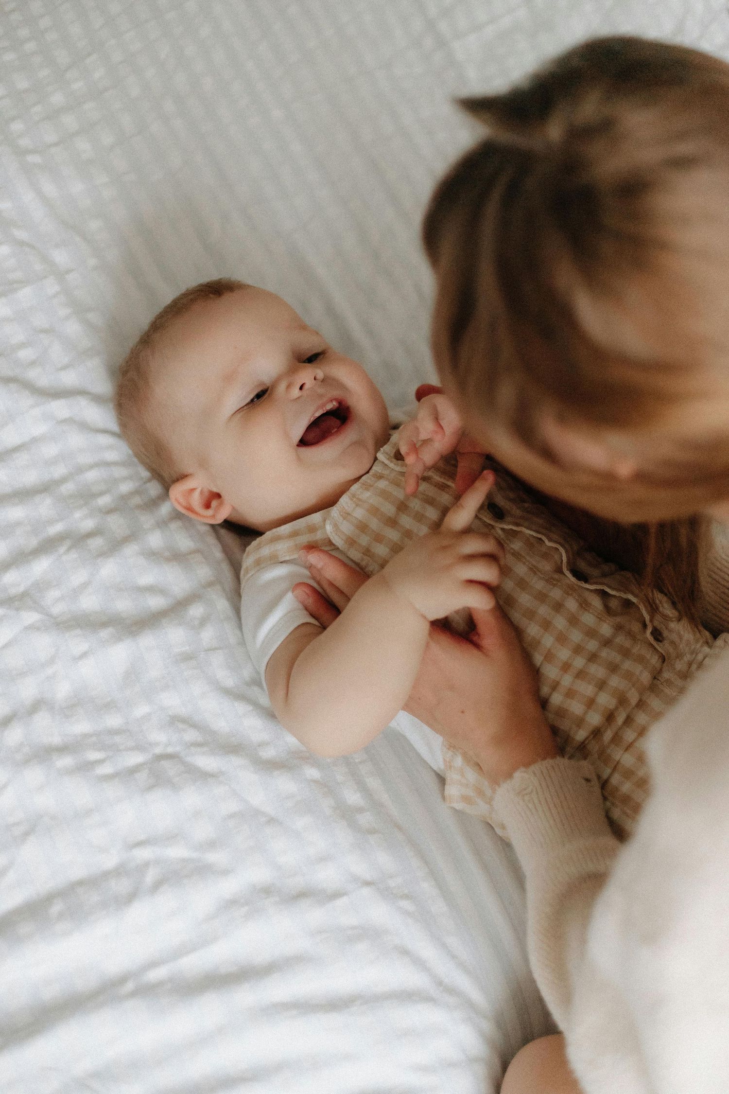 Tucson warm indoor session, playful children with parents, captured as elegant, timeless heirloom portraits.