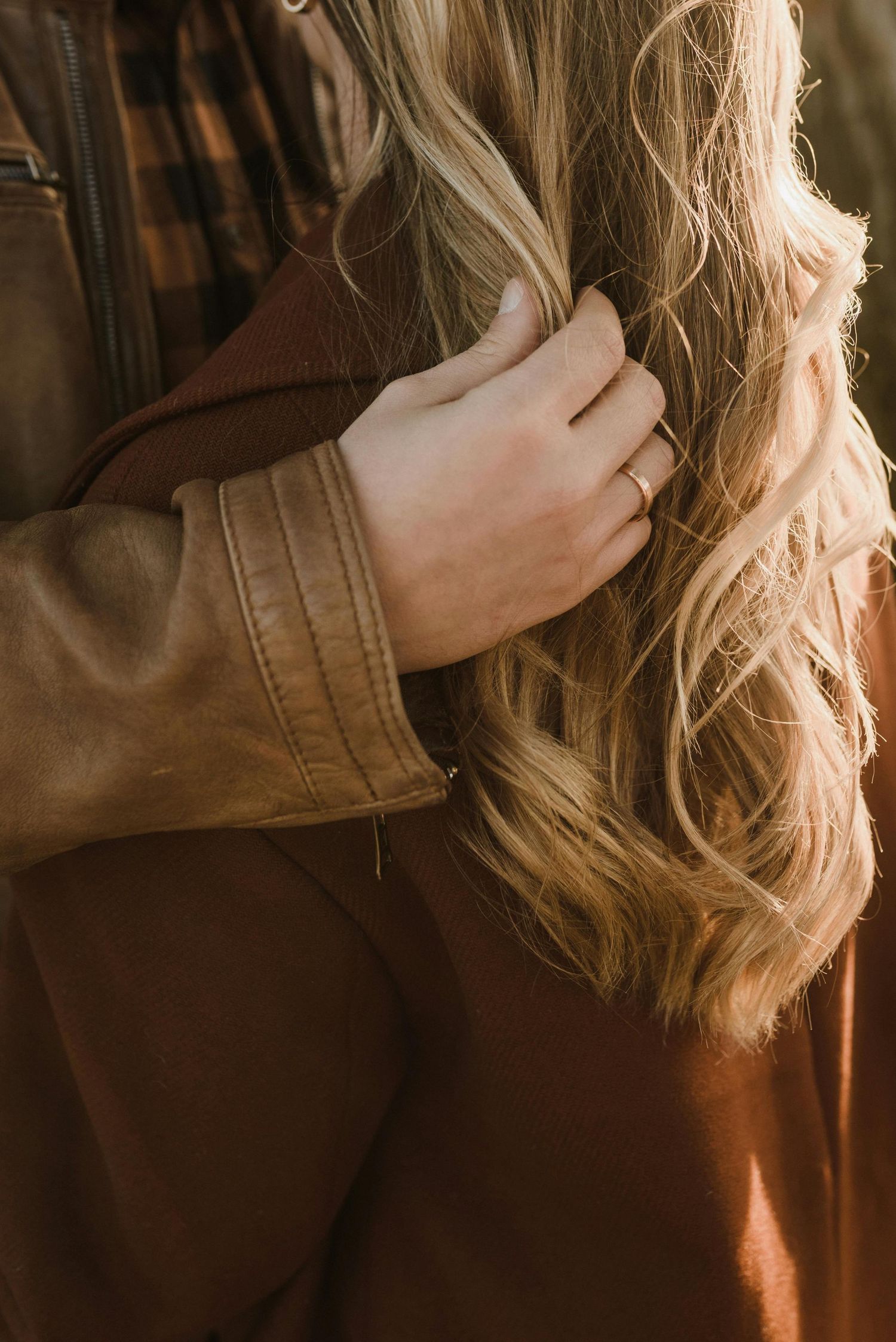 Prescott mountaintop proposal, warm golden light, young lovers, red hat, captured by luxury engagement photographer Arizona.