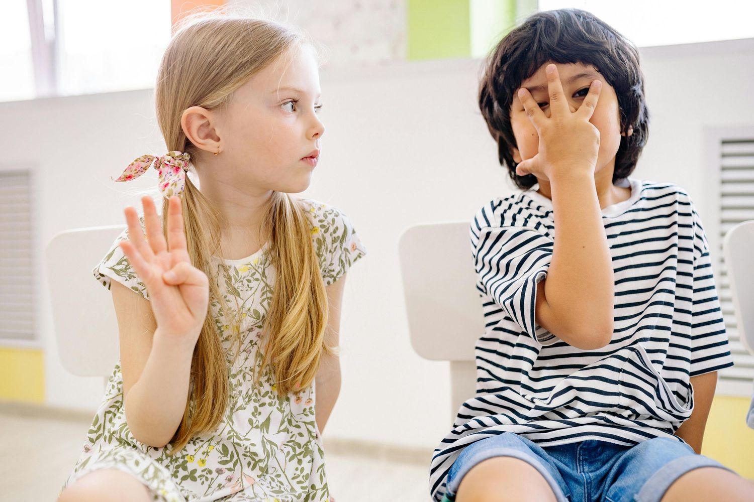 Queen Creek  Arizona Daycare Photography Students gesturing and expressing themselves during an educational activity.