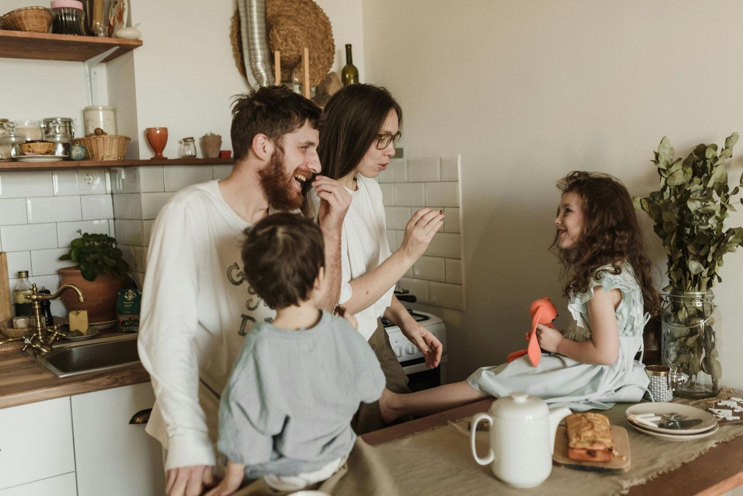 Superior family portraits in their home, kids and parents smiling together, photographed by an Arizona family photographer.