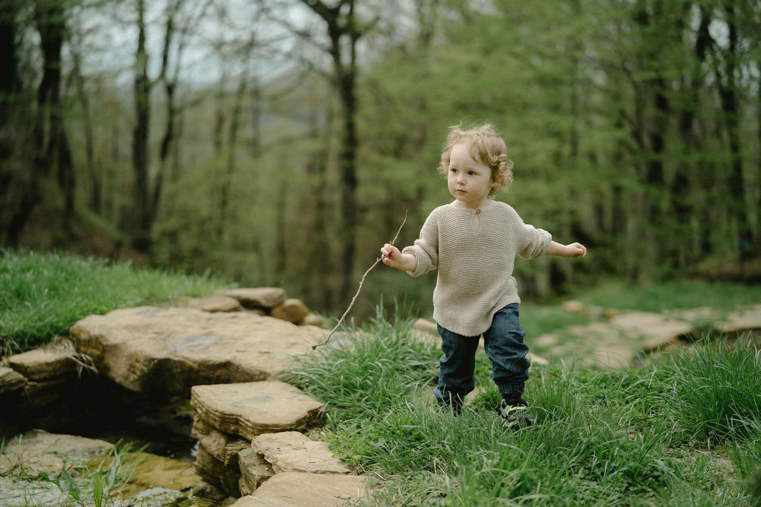 Kingman Arizona Family Photography  A child carefully balancing while walking on natural stone steps.
