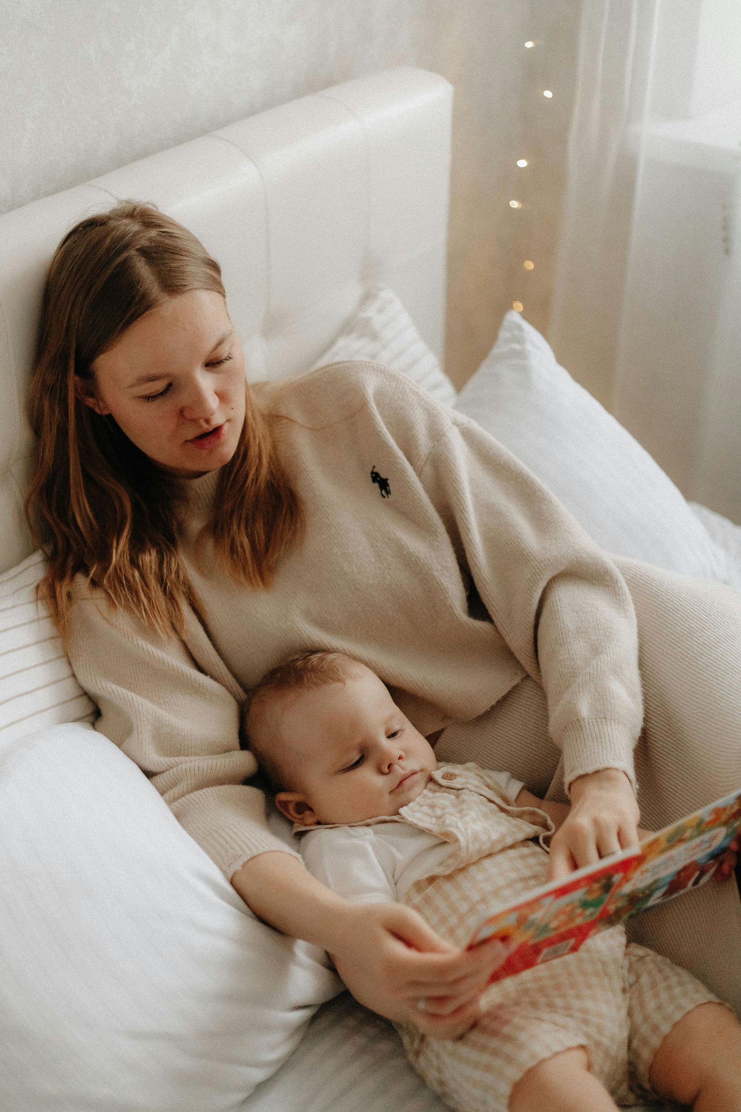 Flagstaff cozy home session, parents hugging kids, golden light, photographed by top Arizona family photographer for timeless memories.