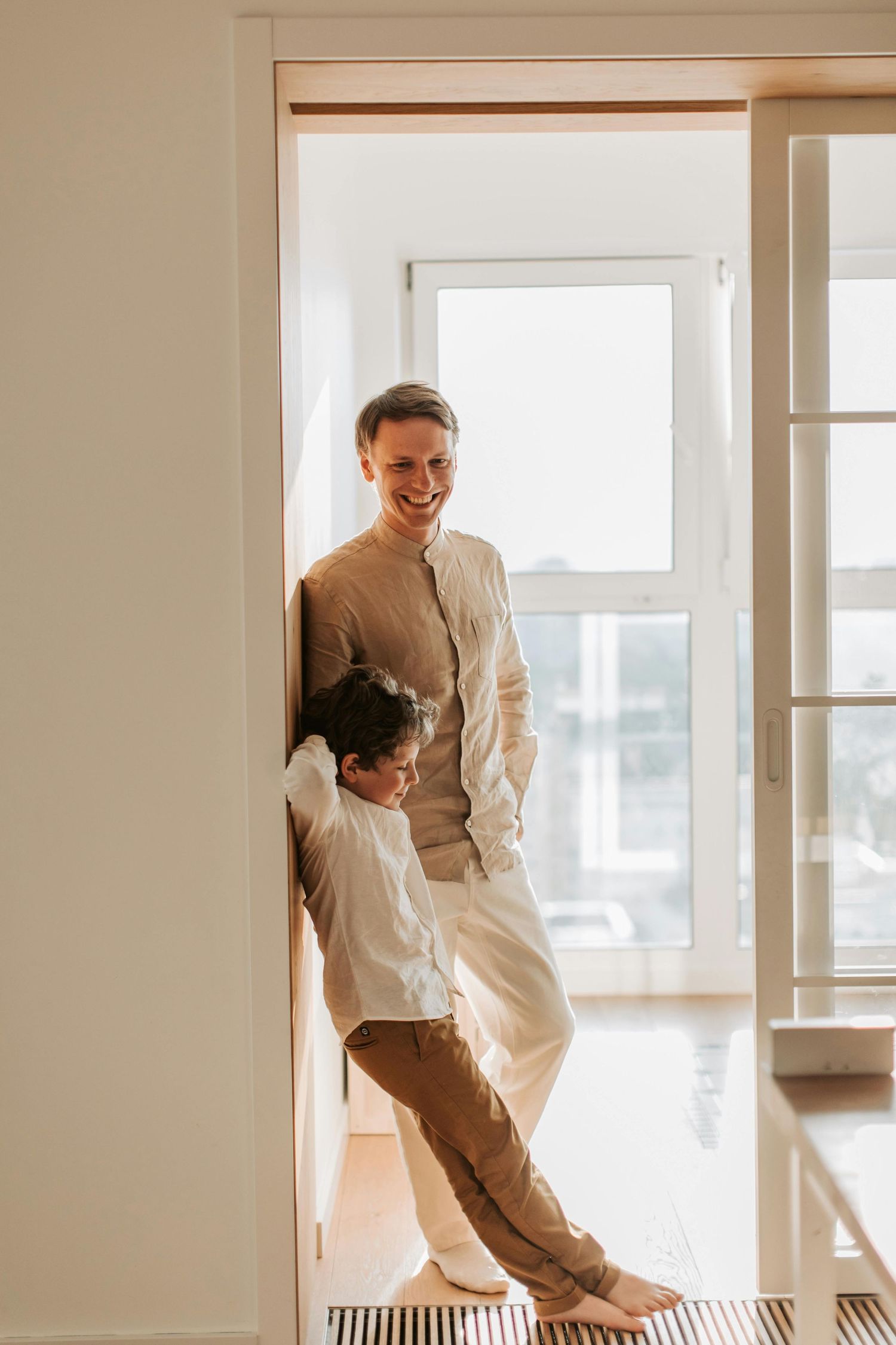 Tucson bright studio family portrait, golden-hour glow indoors, captured by Arizona family photographer.