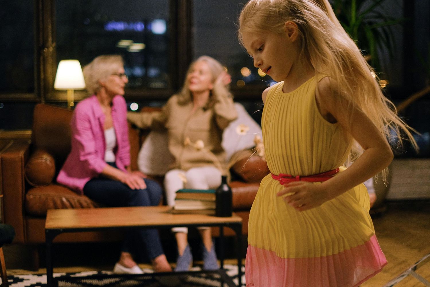 A series of candid moments showing people sitting and interacting in a dimly lit interior space.