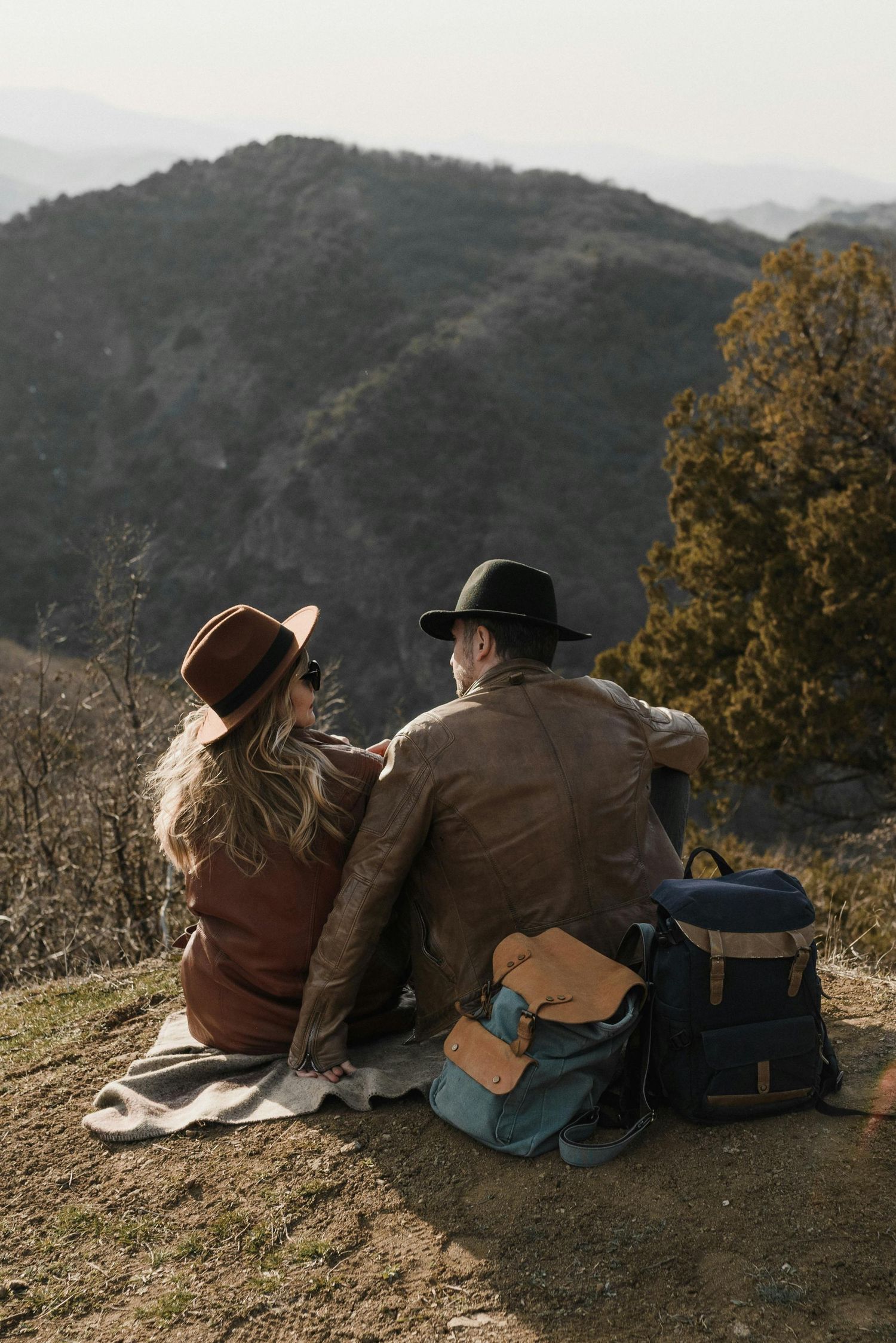 Kingman sunset engagement, red hat shining, young lovers, captured by luxury Arizona engagement photographer.