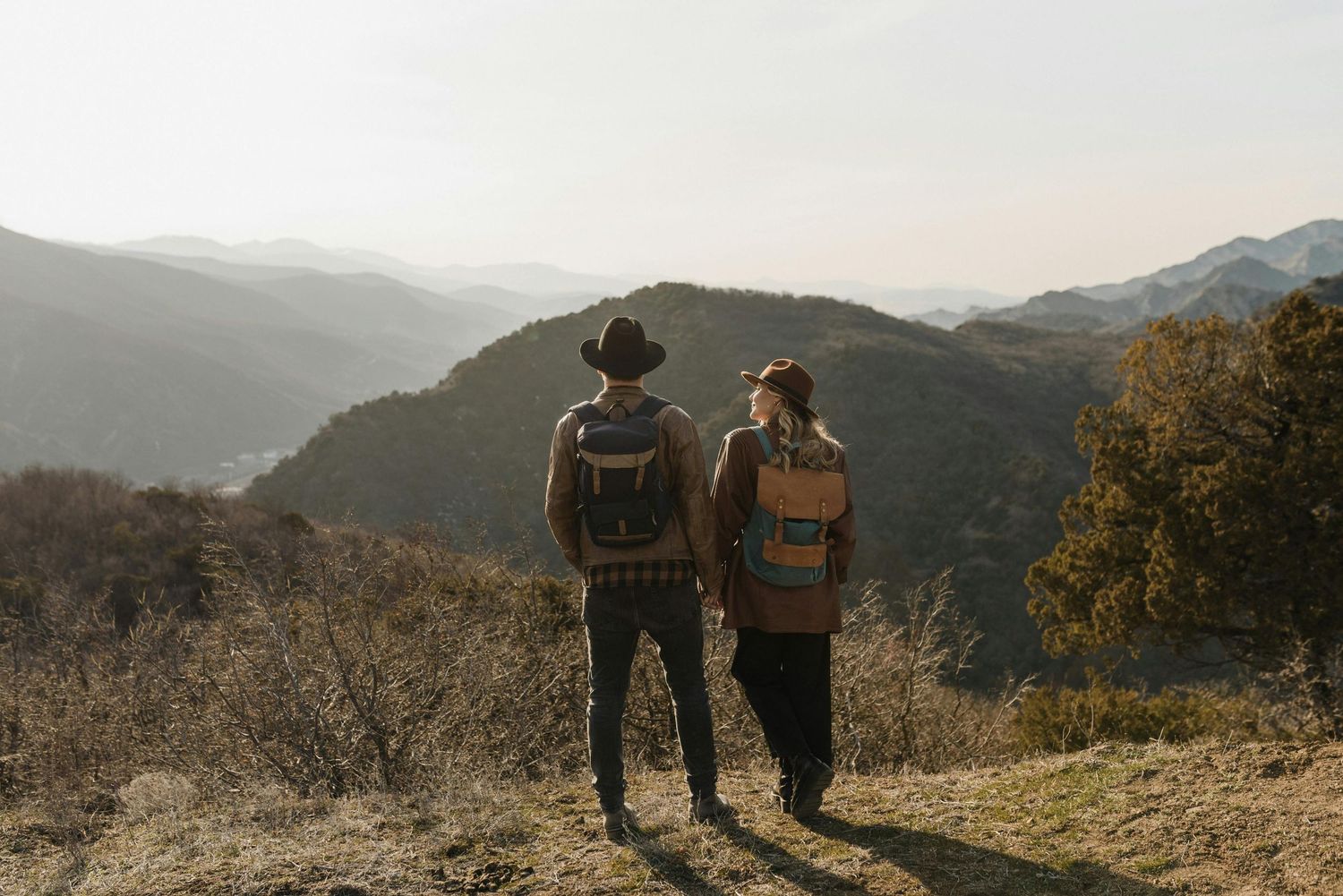 Tucson canyon engagement, romantic surprise, young couple, red hat elegance, captured by top Arizona engagement photographer.