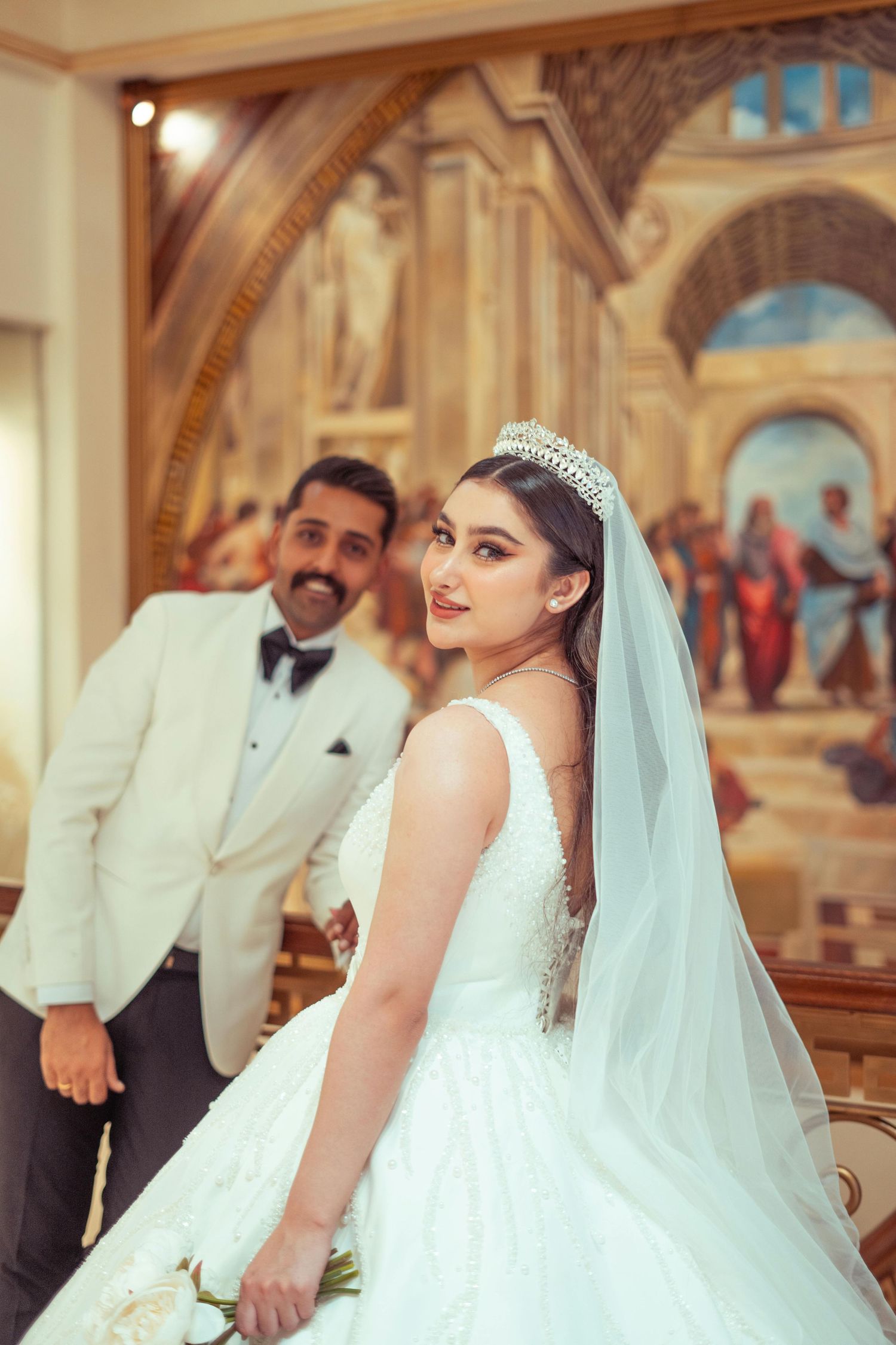A series of wedding photos showing a couple in traditional attire inside an ornate church or cathedral setting.  Award Winning Photographer