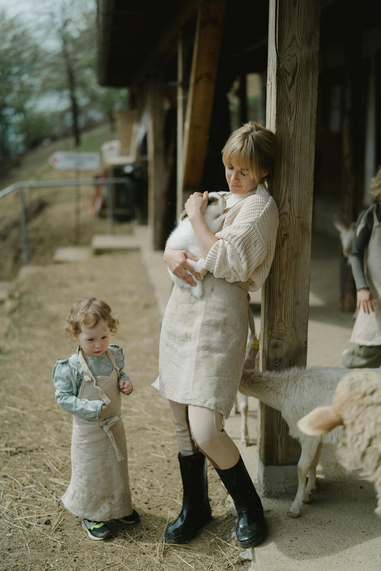 Kingman Arizona Family Photography  Children playing near wooden posts on a dirt path.