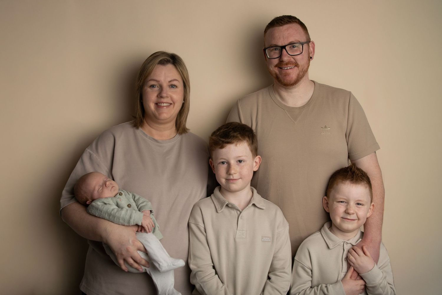 Family of 5 in photoshoot with their newborn baby