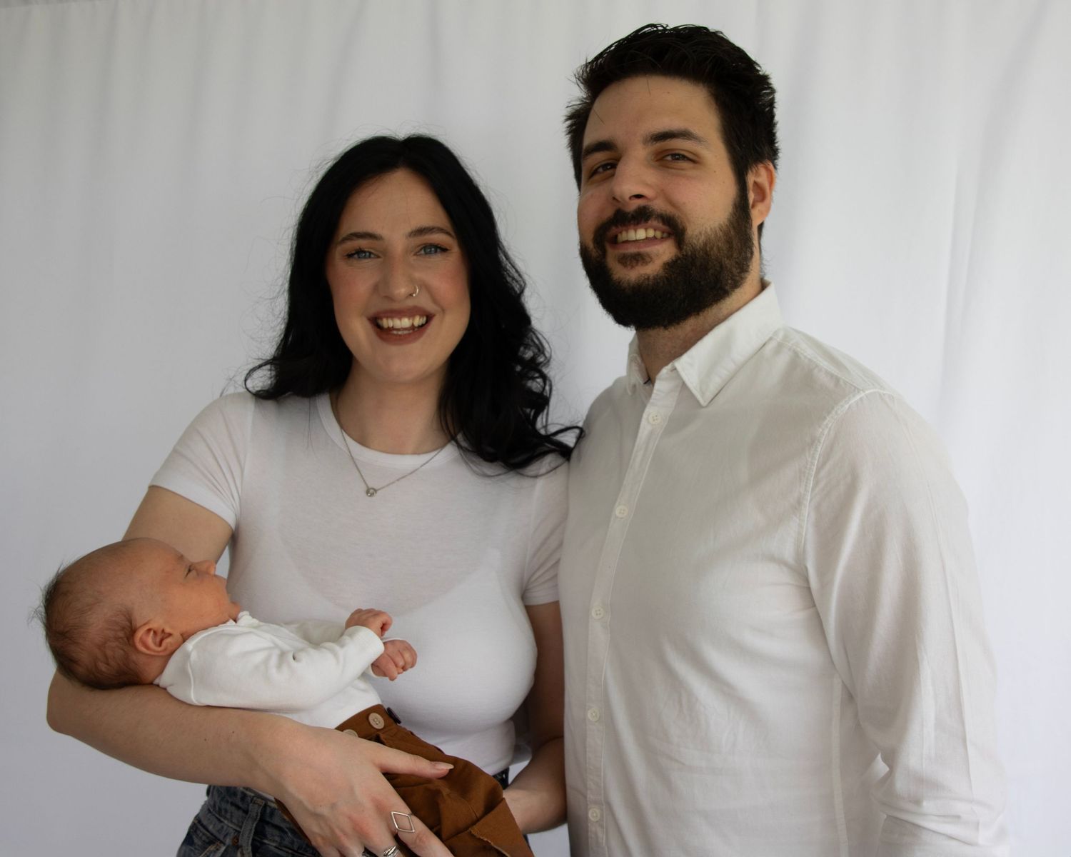New parents with their newborn in a photo session  near Cork city