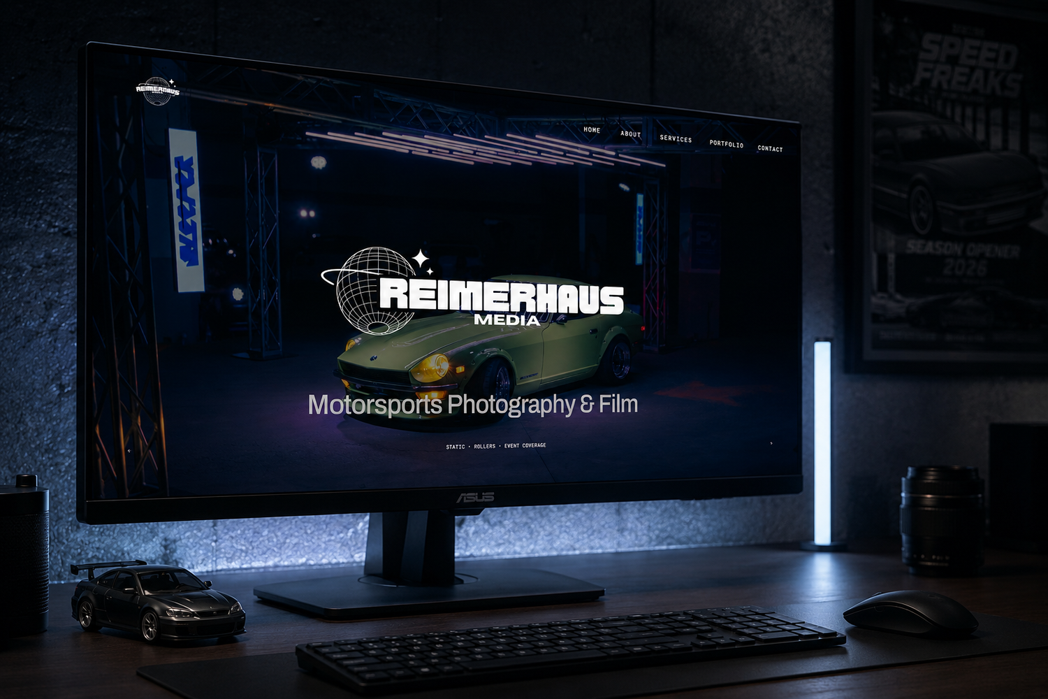 A dark desktop monitor displays the Reimerhaus Media motorsports photography and film website featuring a green sports car.