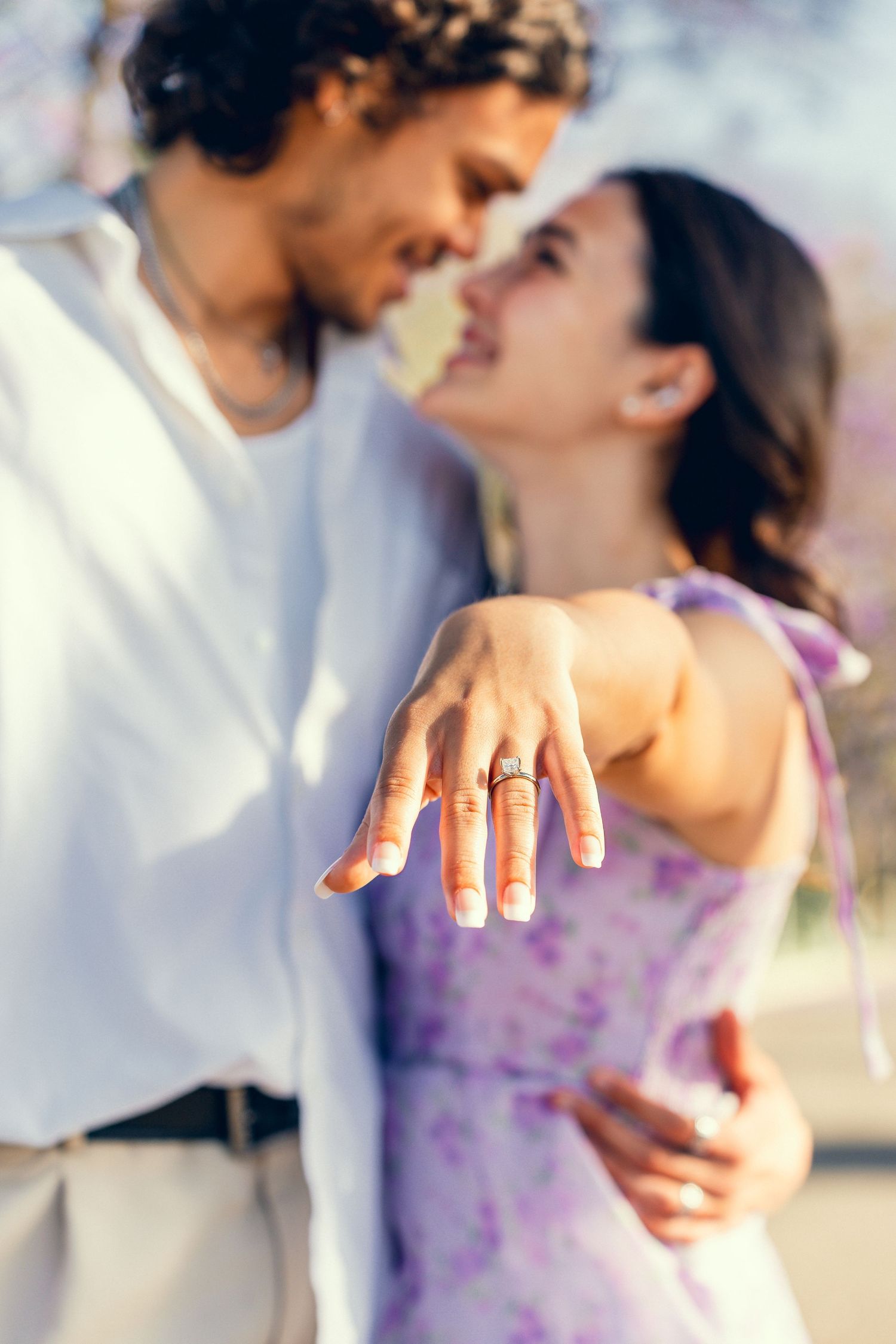 Close-up shots of an engagement ring and happy reactions after a proposal.