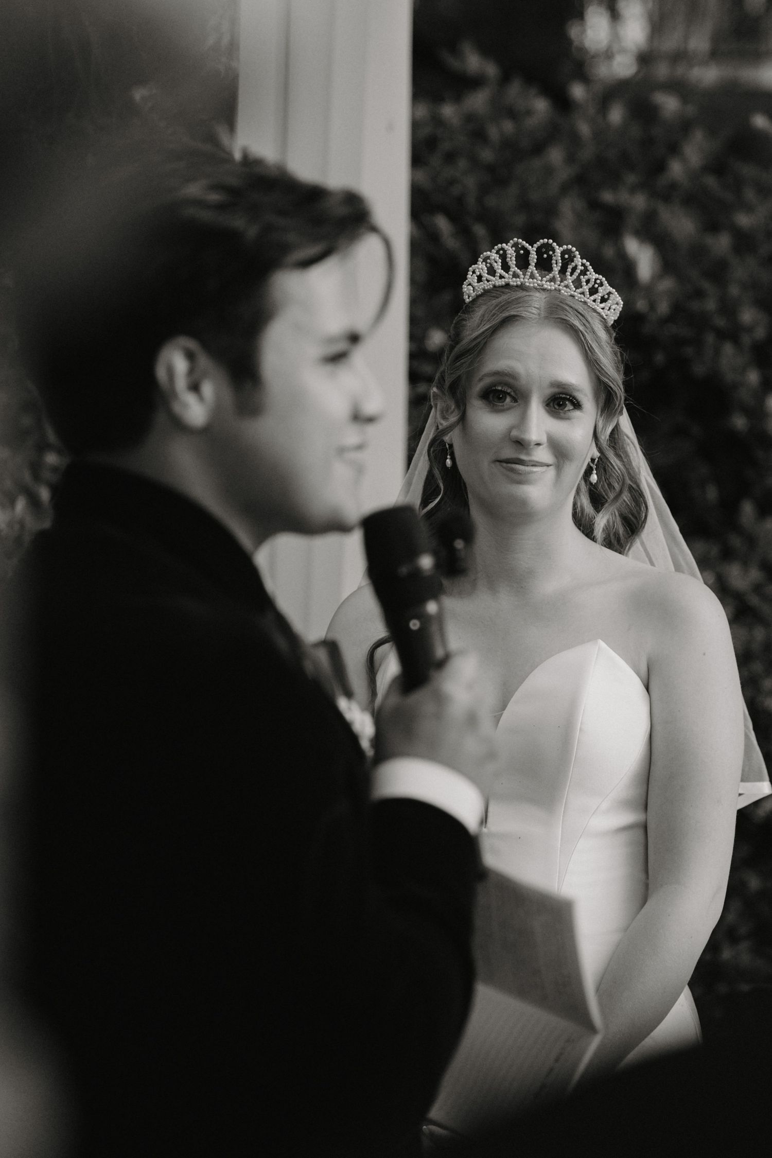 Black and white wedding photo sequence showing tender moments between newlyweds in romantic poses.