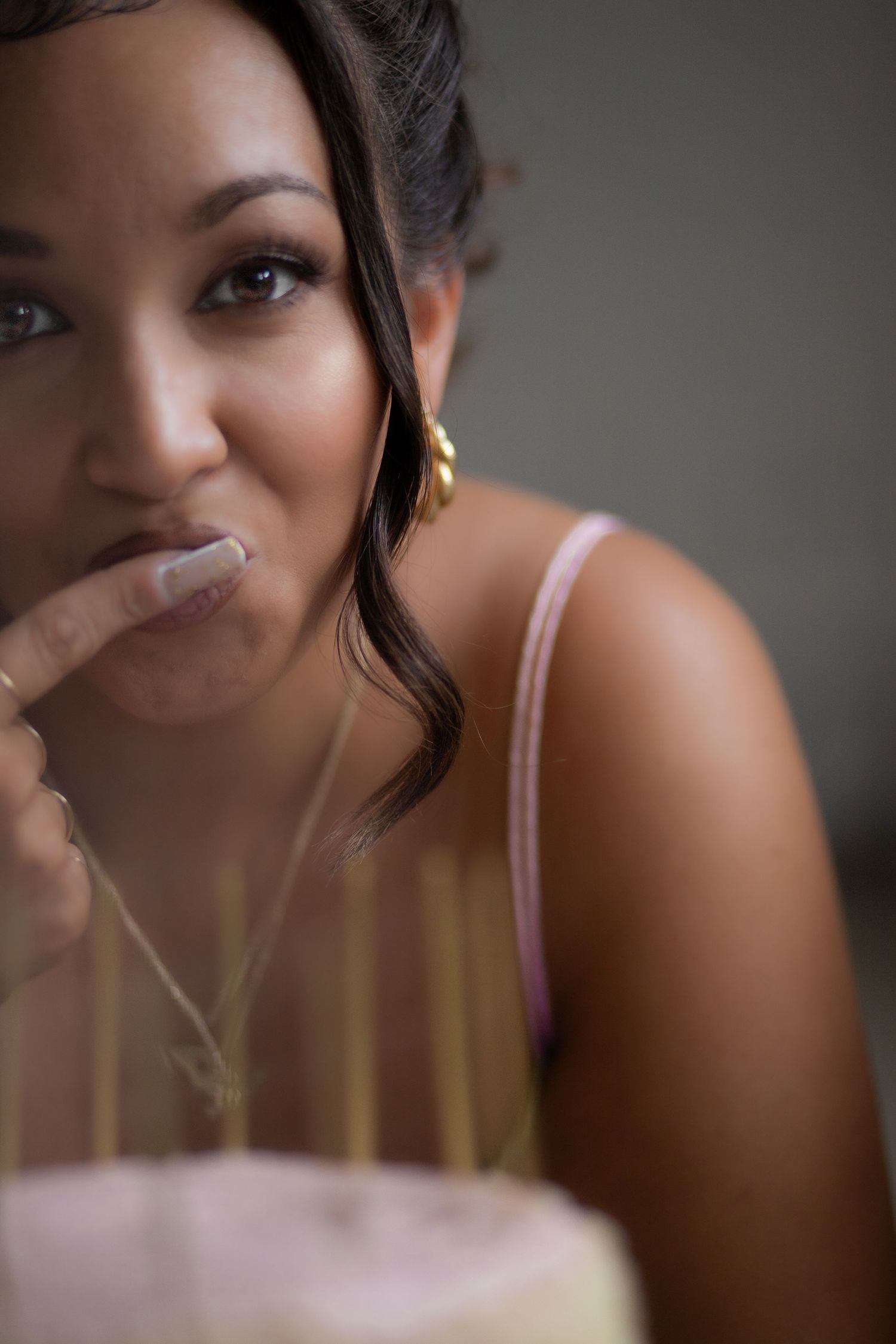 Candid expression shown through soft focus portrait with shallow depth of field.