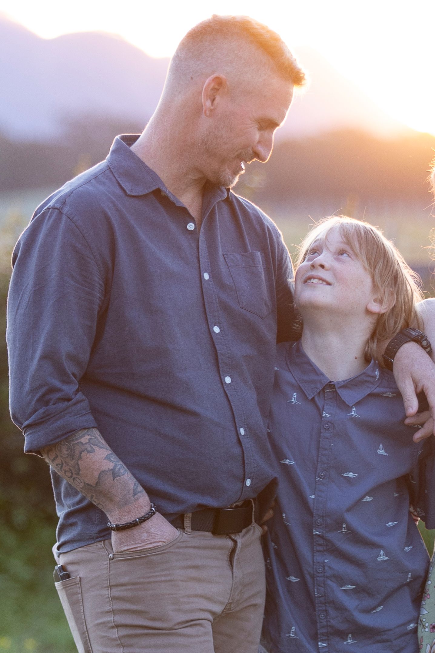 Intimate sunset portrait session in a countryside setting.