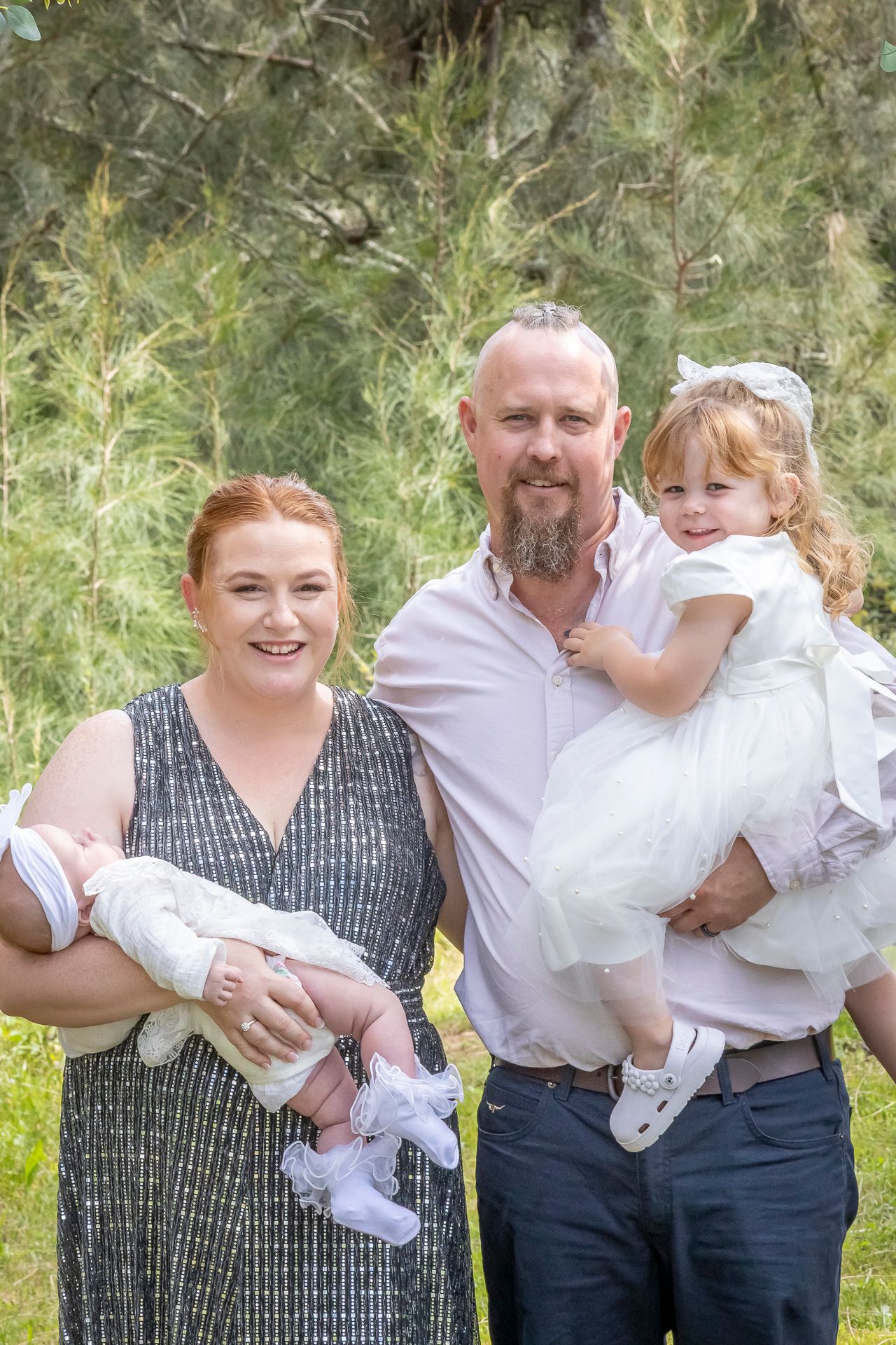 A family portrait series of four candid moments showing playful interactions outdoors against a natural green background.