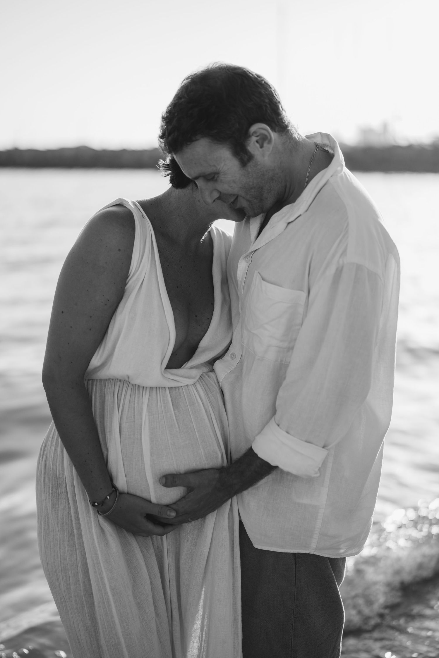 Romantic black and white beachside maternity photo session.