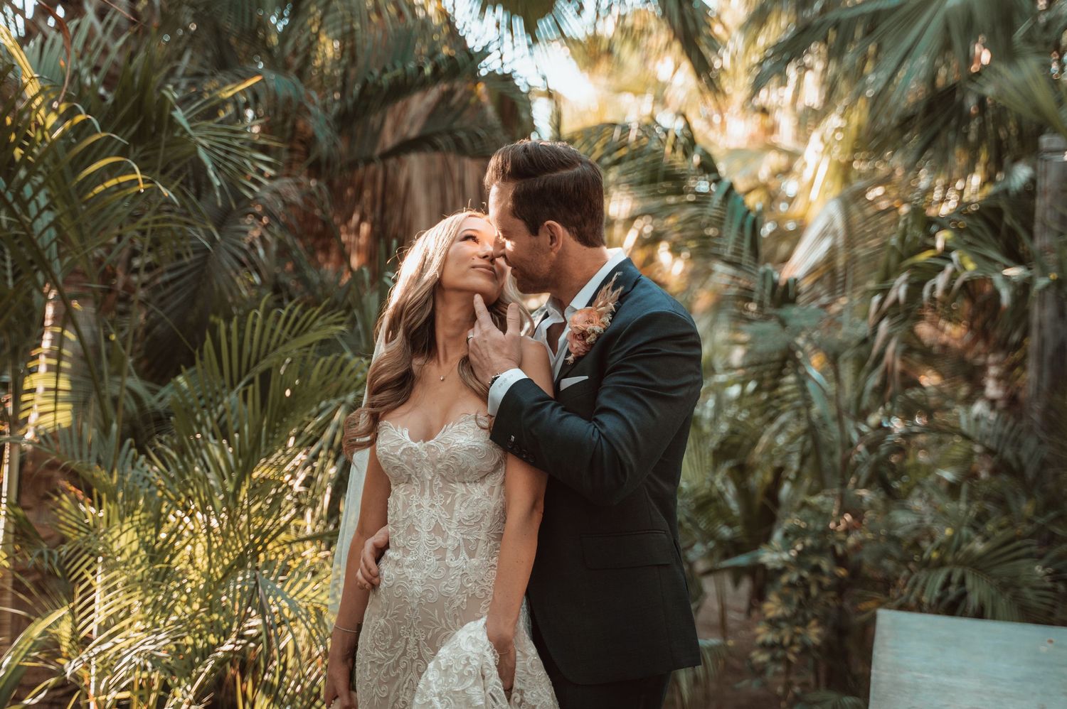 Wedding photographs in a lush tropical garden setting with palm trees.