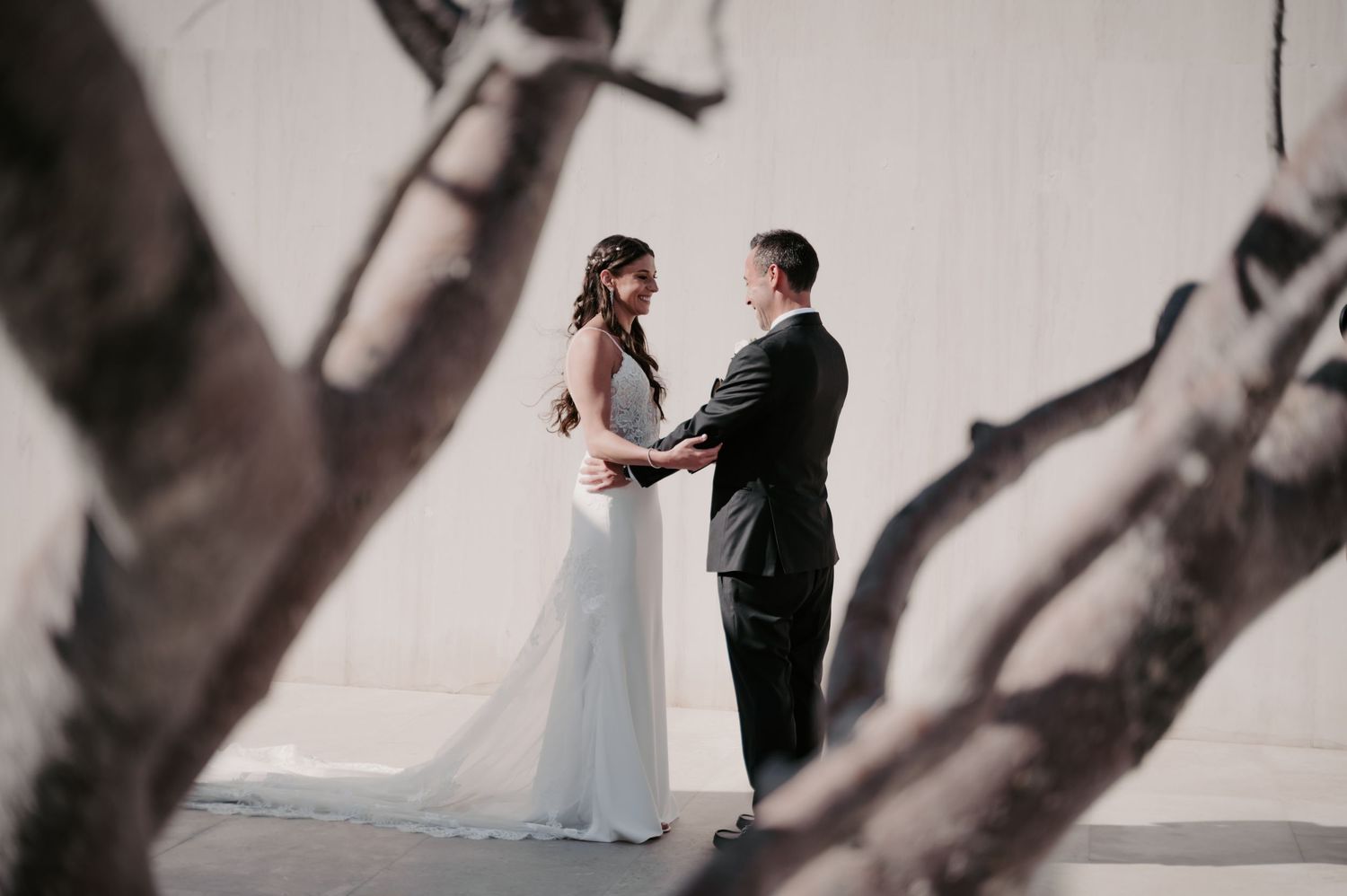 Minimalist wedding photography featuring artistic shadows and clean architectural lines.