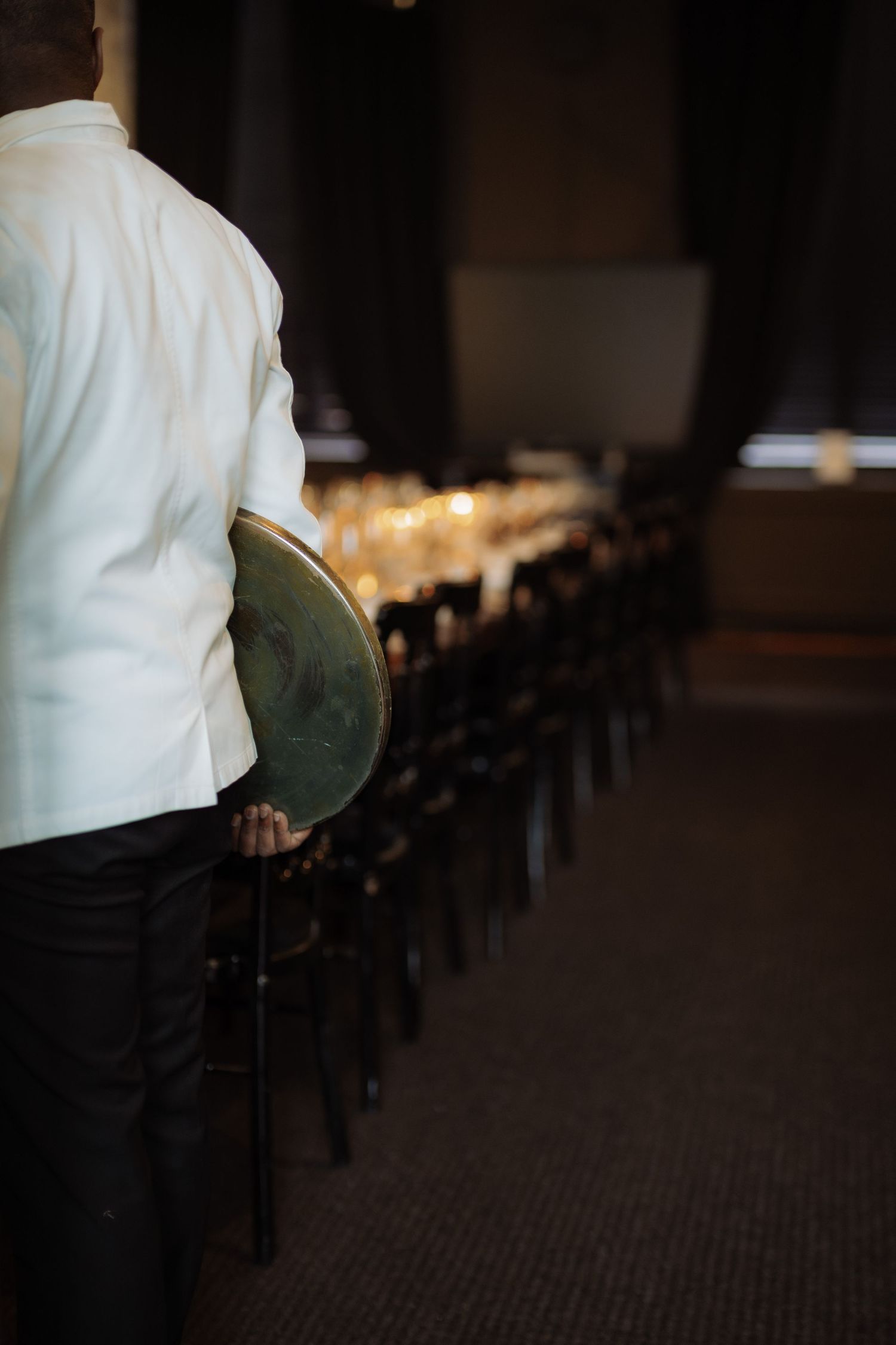 A waiter waiting for guests to arrive