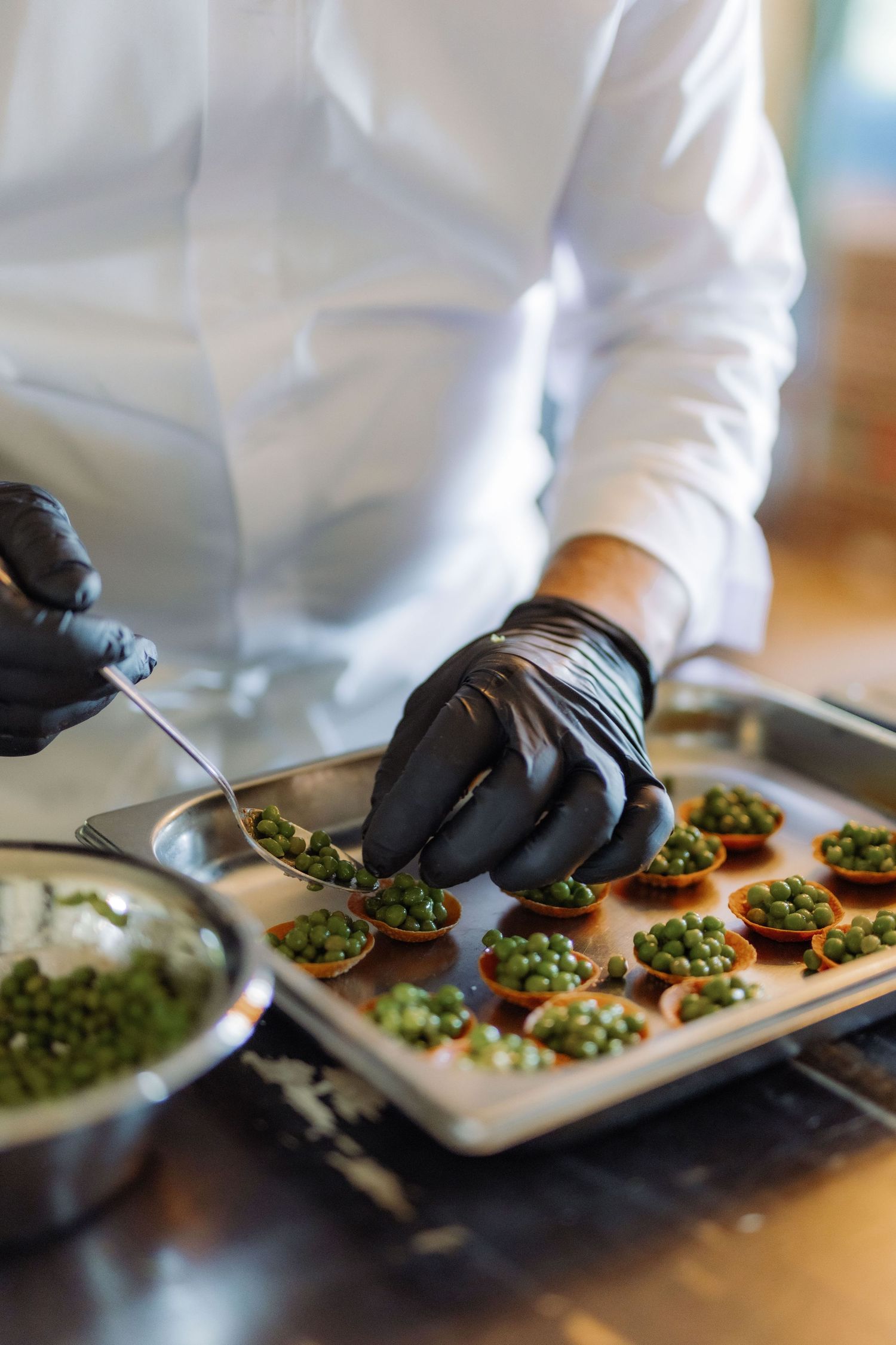 a chef prepares a starter for guests