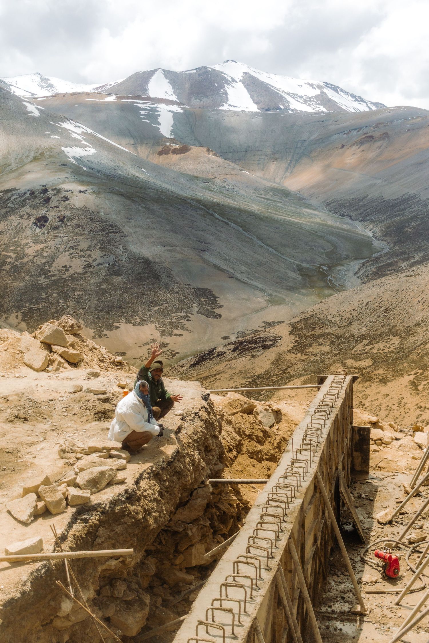 Workers building a larger road in the Himalayan mountains in Northern India