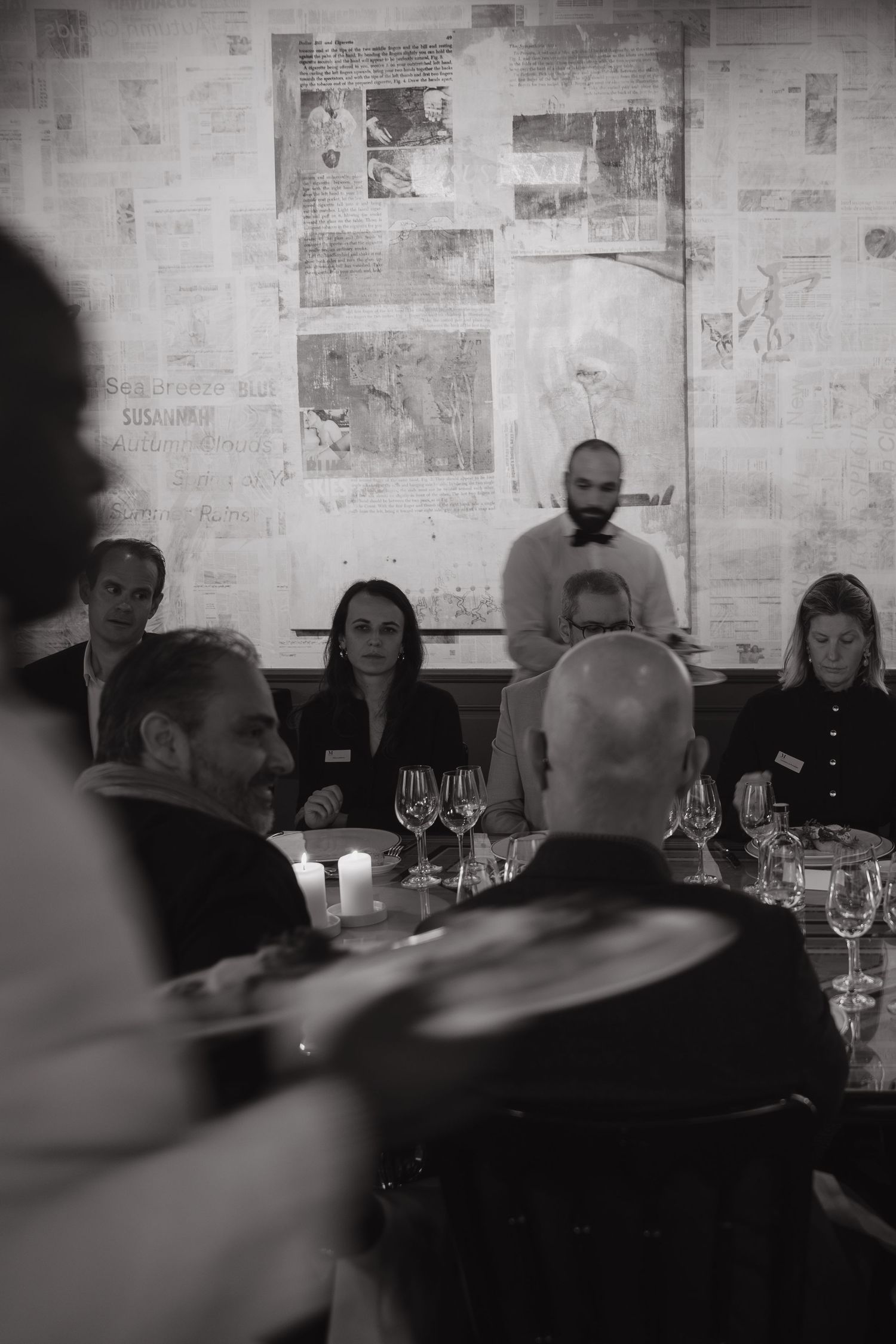 Waiters bringing food to guests
