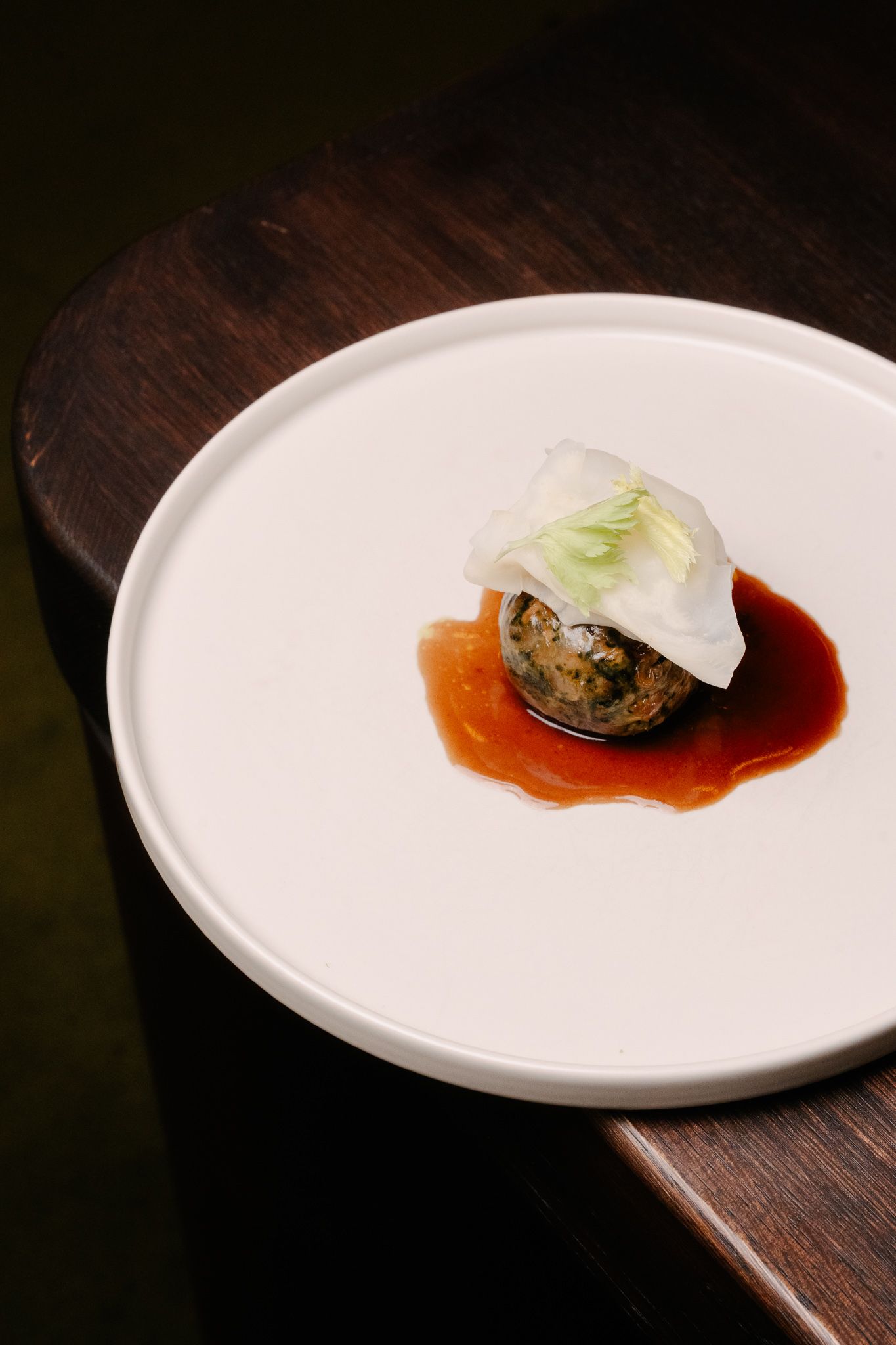A plate with a gastronomic dish in it.