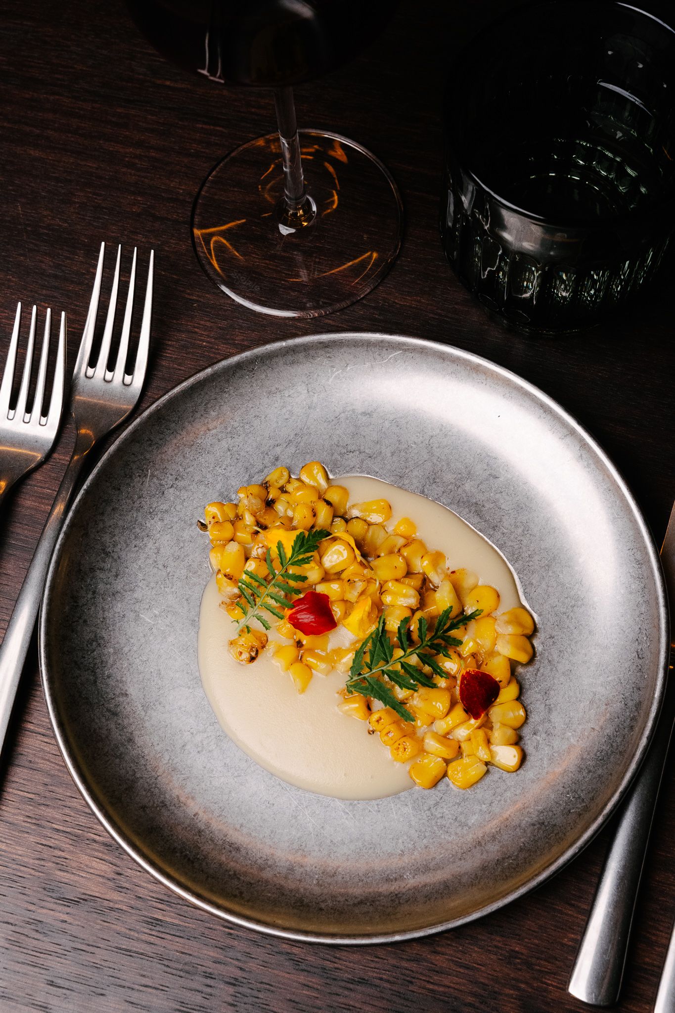 A picture of a starter with a glass of wine