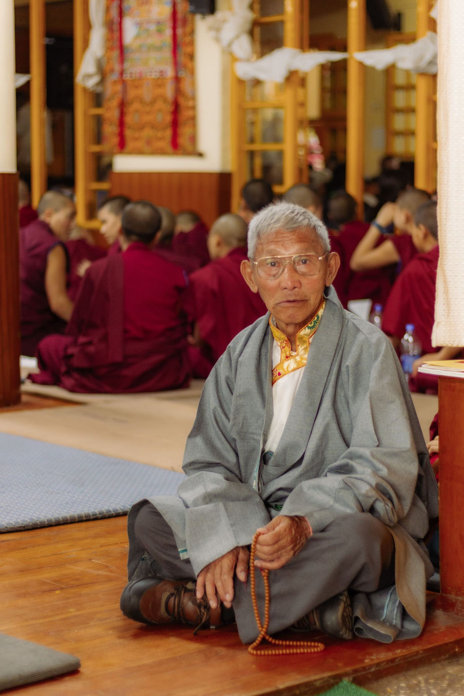 a buddhist monk at the Dalai Lama's 85th birthday celebration in Dharamsala, India