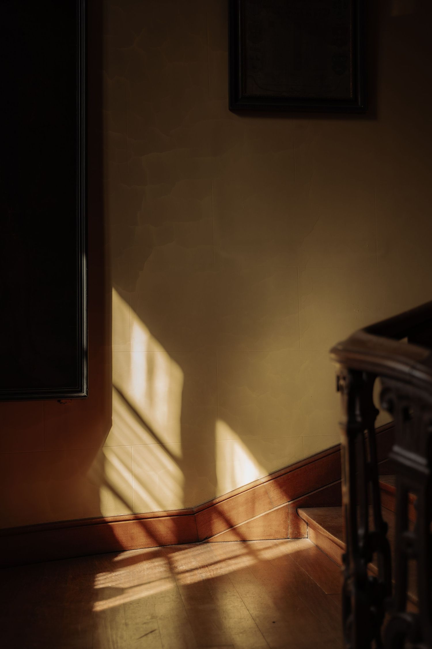 The shadow from the window creates a beautiful view in a stairway