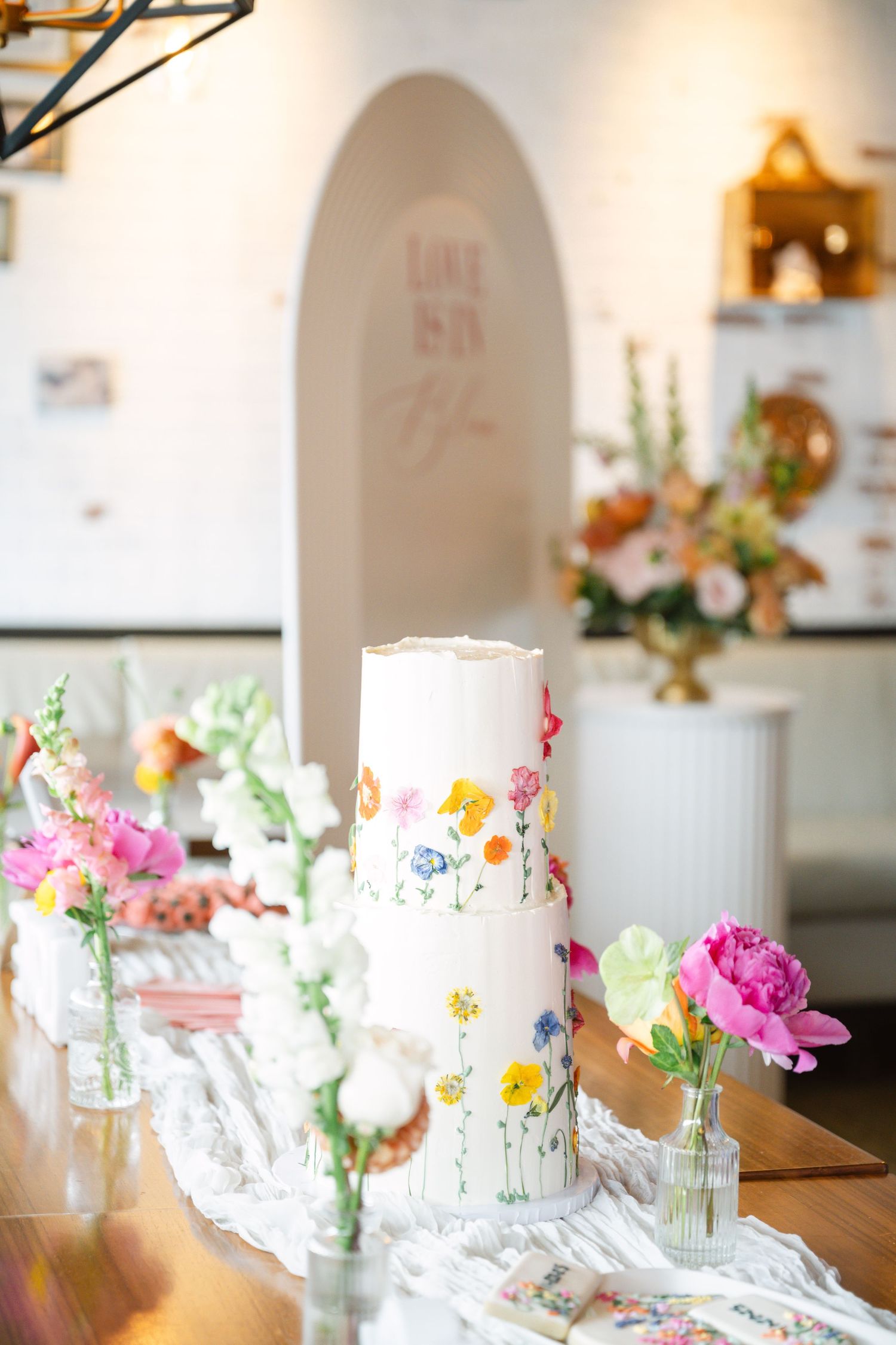 Floral cake and dessert table setup detail shot for a bridal shower in Vaughan, photographed by a Toronto lifestyle and event photographer.