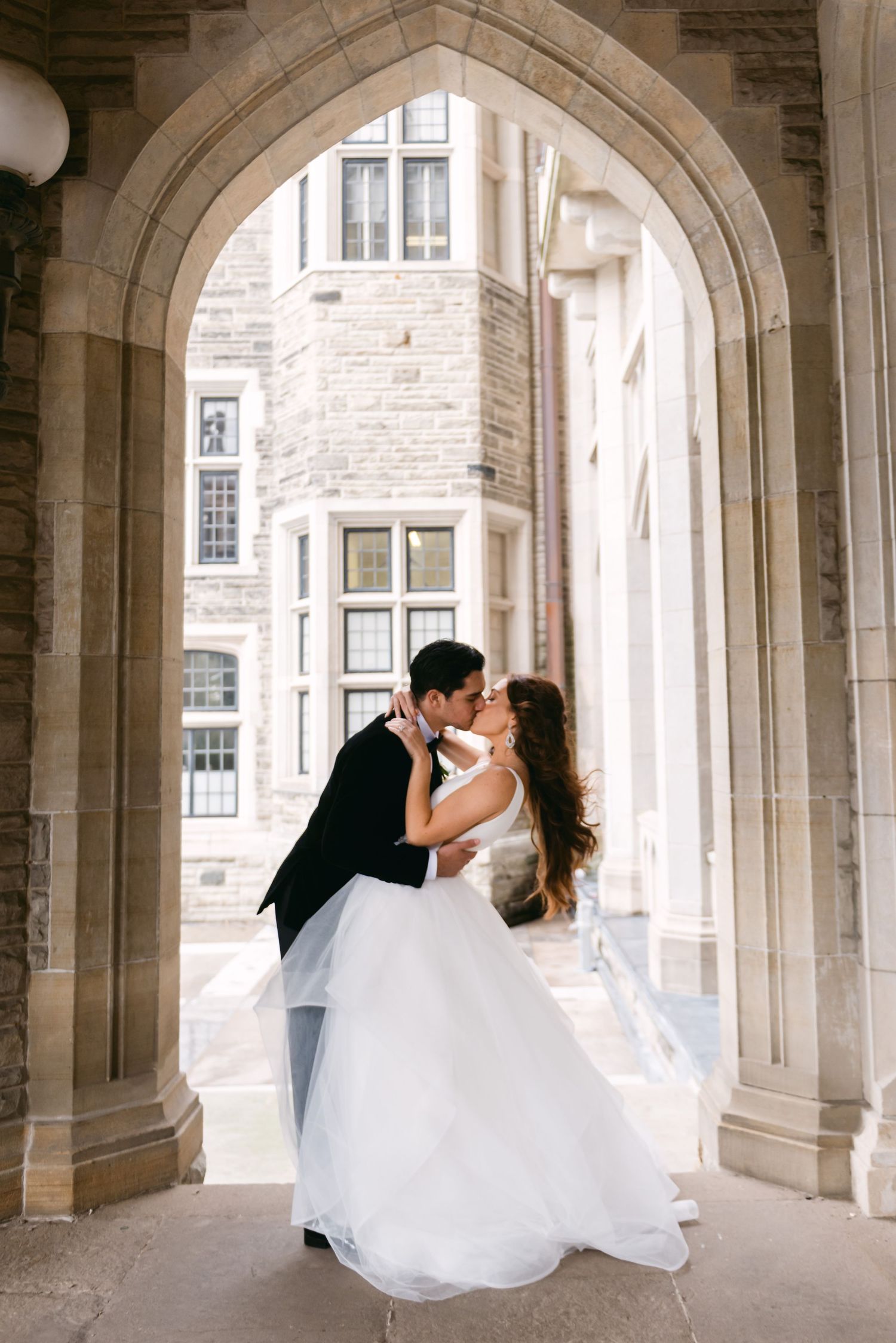 Portrait of a bride and groom at Casa Loma on their wedding day, photographed by a Toronto wedding photographer.