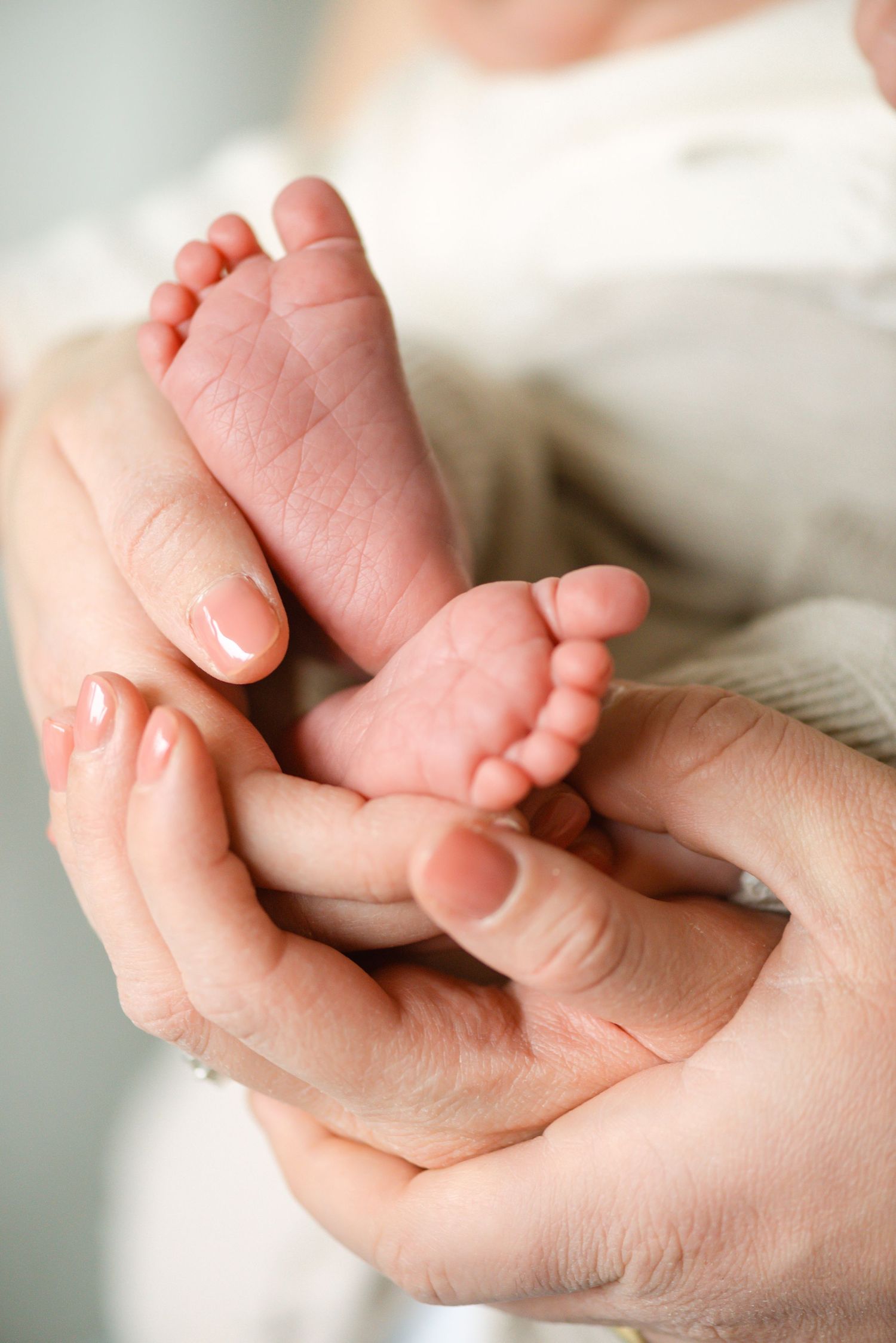 Close-up detail of newborn baby’s feet, photographed by a Toronto lifestyle and newborn photographer.