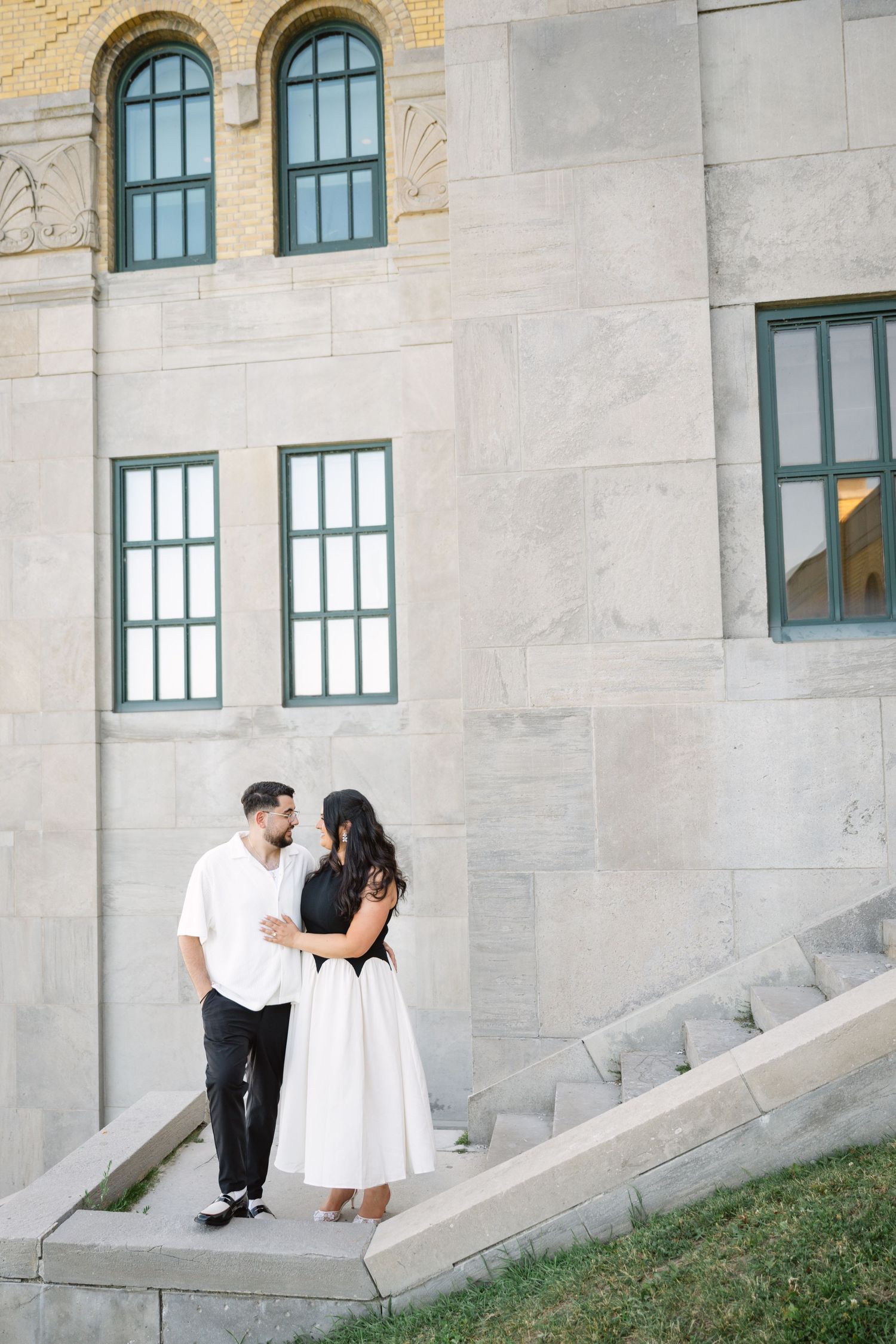 Candid engagement photo of a couple at RC Harris Treatment Plant, captured by a Toronto lifestyle and engagement photographer.
